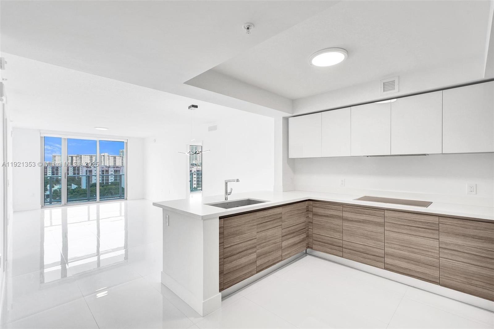 RESIDENCE AT PARQUE TOWERS 2 BED + LARGE DEN, 3 BATHS, EXPANSIVE BALCONY OVERLOOKING SUNNY ISLES SKYLINE, OCEAN & INTRACOASTAL, WHITE PORCELAIN TILE THROUGHOUT, HIGH CEILINGS & IMPACT GLASS WINDOWS. KITCHEN HAS HIGH END APPLIANCES, ITALKRAFT CABINETS AND BREAKFAST BAR. MASTER BEDROOM HAS LARGE WALK IN CLOSET, LINEN CLOSET, LUXURIOUS BATHROOM WITH SEPARATE SHOWER & BATHTUB. ONE ASSIGNED PARKING SPACE, ONE VAKET AND STORAGE UNIT. BUILDING AMENITIES: FOUR POOLS, JACUZZI, GYM, BUSINESS CENTER, GUEST SUITES, WATERFRONT PATH, BUSINESS CENTER, FULL SIZE MOVIE THEATER, 24/7 FRONT DESK AND VALET.