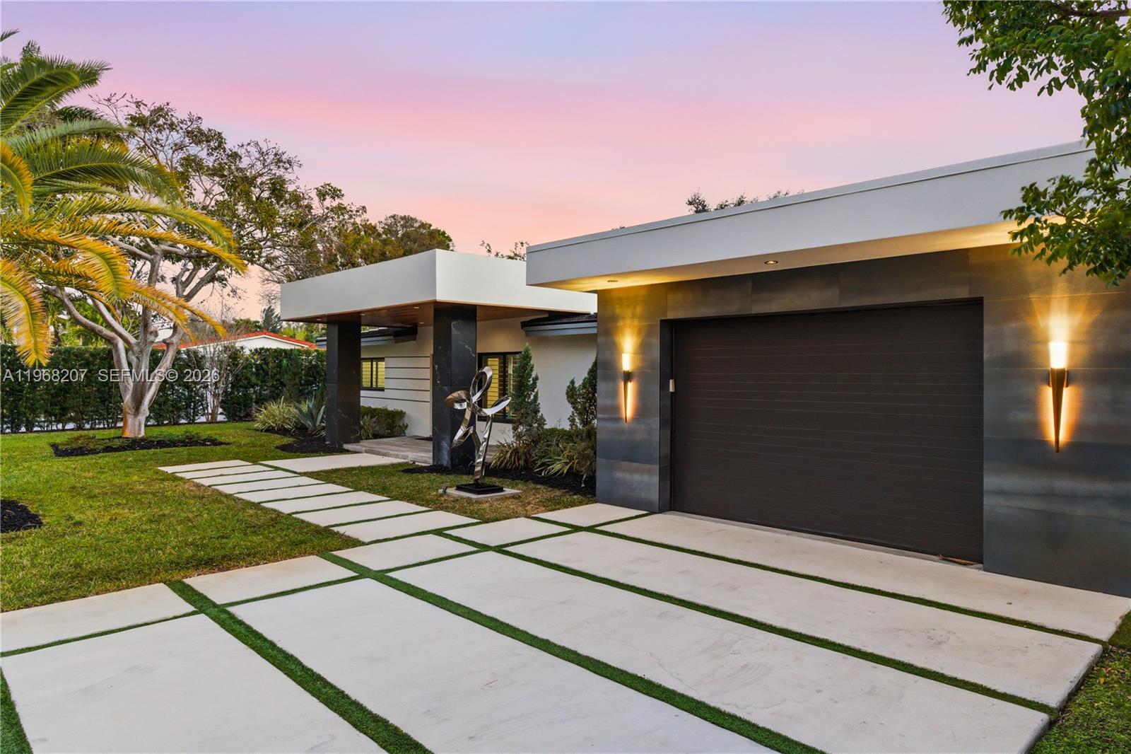 This extraordinary, one of a kind estate is an entertainer's dream, Fully renovated from top to bottom and enhanced by a 1328 sq. ft. addition bringing the total square foot to 3127 completed in 2021, Offering five bedrooms 5 baths and a private guest house with its own kitchen and rooftop terrace perfect for taking in breathtaking Florida sunsets. The moment you enter, Your eyes are immediately drawn to the all- inspiring backyard- An oversized, Lushly land Oasis featuring a spectacular, separate in ground hot tub, and a stunning view of the guest house that no Other property can replicate. Inside, the home boasts a gourmet chef's kitchen with high end appliances a summer kitchen seamless indoor outdoor living energy efficient impact windows and doors, porcelain tiled throughout the main Living areas hardwood flooring in the primary suite, and countless premium upgrades. Designed for those who appreciate luxury, privacy, and unforgettable entertaining, this residence stands truly in a class of its own.