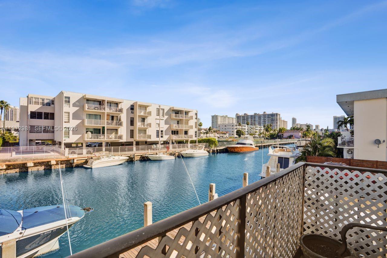 Beautiful 2BR/2BA waterfront residence in desirable Eastern Shores offering over 1,000 sq ft of living space. This spacious unit features a partially updated interior and a functional layout ready for your personal touch. Enjoy direct canal views from your private balcony, perfectly positioned on the north-facing façade to provide cool shade all afternoon while overlooking the water and passing boats. The building offers a community dock and a navigable canal, ideal for boating enthusiasts. Located in a quiet neighborhood surrounded by multimillion-dollar waterfront homes, this property combines tranquility with an upscale setting. Plenty of guest parking is available. Great opportunity to own in a prime waterfront location.