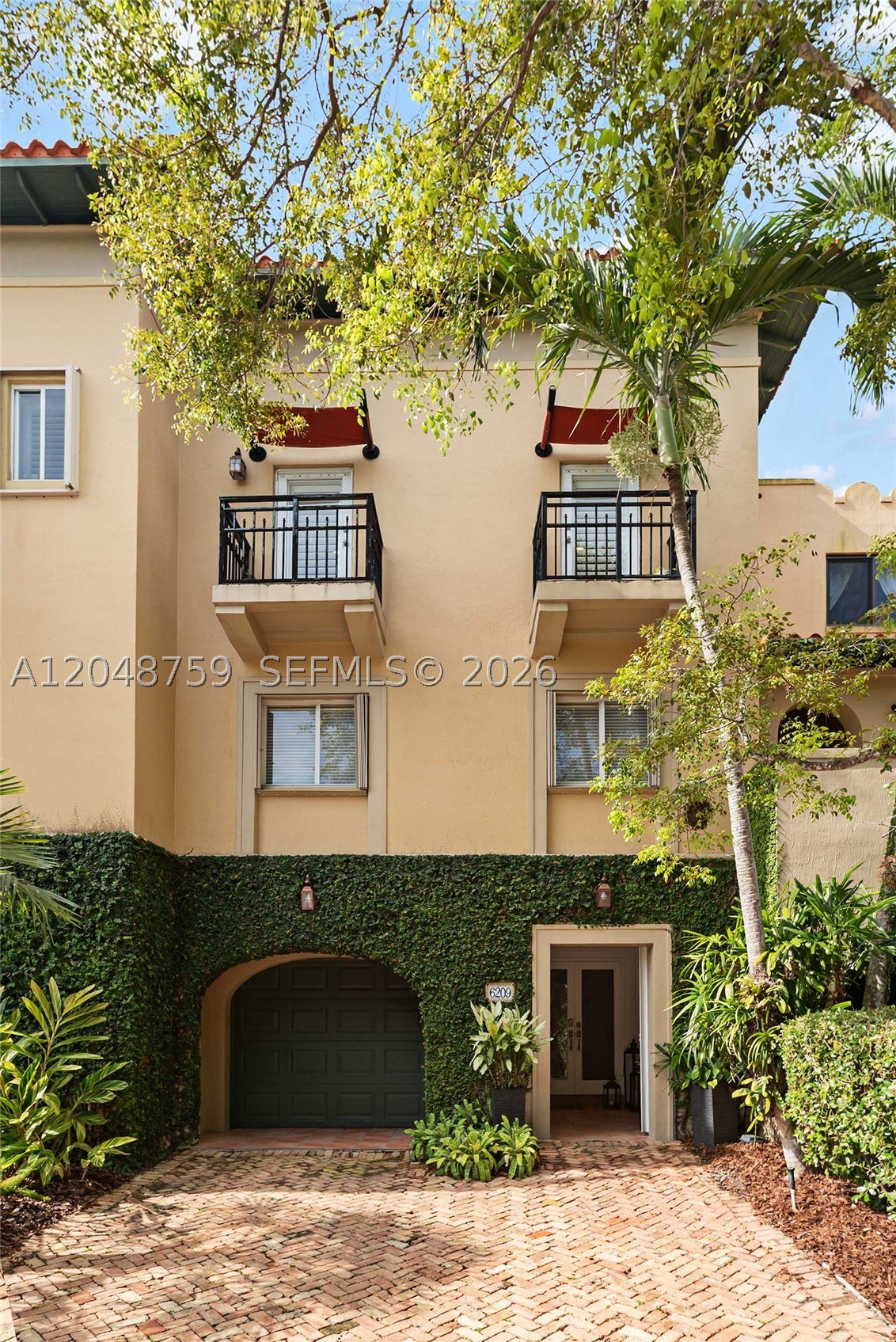 Driftwood Cove invites you to embrace the effortless waterfront lifestyle you've been dreaming of. Priced well below recent comparable sales, this exceptional tri-level townhome in the exclusive, gated Royal Harbour Yacht Club offers an incredible opportunity to create your own coastal retreat. Featuring 3 spacious bedrooms, 2.5 bathrooms, and a tandem garage, this residence is designed for comfortable living and entertaining. The expansive second level offers two inviting living areas, a generous kitchen, and a dining space that seamlessly brings family and friends together. Above it all, the private rooftop terrace provides the perfect setting to unwind with morning coffee, evening cocktails, or simply enjoy the coastal breeze. Move in and enjoy the home as it is, or personalize it with your own style and updates to make it truly yours. Life at Royal Harbour Yacht Club feels like a year-round vacation. Residents enjoy a full-service marina, private sandy beach, heated resort-style pool and spa, state-of-the-art fitness center, tennis and pickleball courts, a welcoming clubhouse, and a scenic nature trail leading directly to Biscayne Bay. Launch your paddleboard, watch the boats drift by, or simply relax and soak in the peaceful surroundings. A boat slip may also be available for purchase, subject to availability, making this an exceptional opportunity for boating enthusiasts. Paradise isn't just a destination—it's a lifestyle. Welcome home to Driftwood Cove.