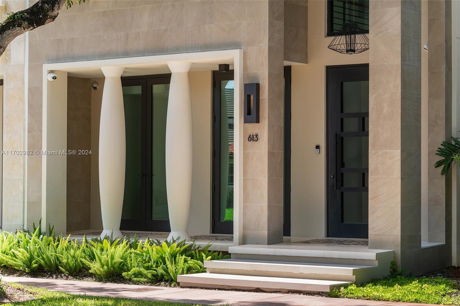 Welcome to your dream home, situated in beautiful Coral Gables.This brownstone-style residence, built in 2021, stands proudly with four stories, featuring a total of five spacious bedrooms, a four-car garage, exquisite custom millwork and interior design, and an impressive rooftop area complete with a pool and breathtaking views.The home showcases an inviting open-air courtyard, equipped with top-of-the-line appliances and a large island perfect for casual dining or entertaining guests. 
The bedrooms offer ample space for family members or visitors and the home office and gym can easily be converted into additional guest rooms or hobby areas to suit your lifestyle.Equipped with smart home technology, various security systems, and a meticulously designed home theater for sports enthusiasts