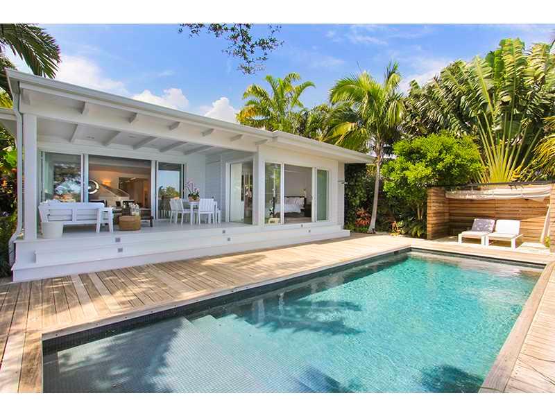 This beautiful waterfront home with spectacular bay views on coveted Venetian Islands features stunning contemporary design & décor. Custom designed by renowned interior designer Stephane Parmentier, this 3 bedroom, 3 and a half bathroom home offers breat htaking water views and spacious dining, living & family rooms. This modern gated home offers an open kitchen w/granite countertops, stainless steel appliances, lush landscaping and a pool/patio w/ bay views and 59' of waterfront perfect for entertaining.