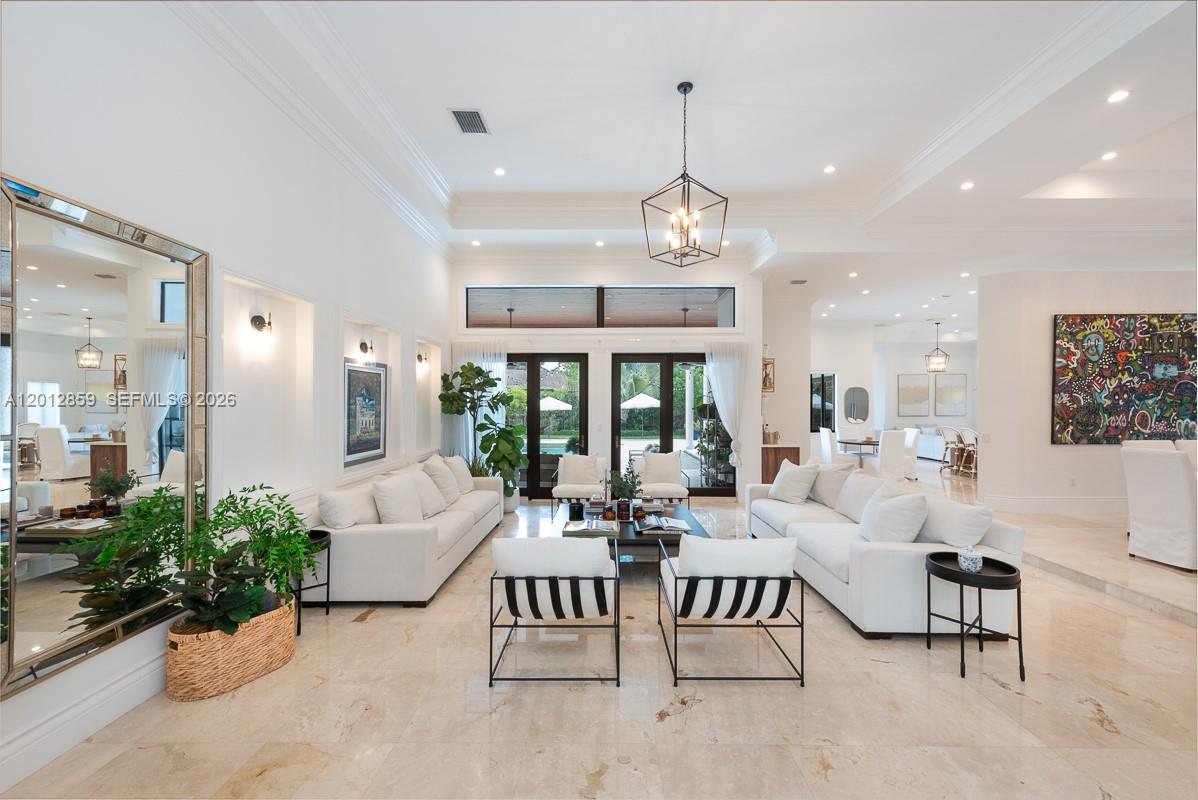 Nestled within the exclusive gated and guarded community of Oak Ridge, this home blends warmth, scale, and timeless luxury in one of Miami’s most private residential enclaves. Set on a 19,000 sqft lot, the residence offers over 4,200 sqft under air and more than 1,100 sqft of covered terraces and outdoor living spaces designed for both intimate family living and gracious entertaining. At the heart of the home is a grand, newly renovated double-island chef’s kitchen featuring high-end appliances, expansive preparation and gathering spaces, and a seamless connection to the surrounding living areas. The 12 and 14-foot ceilings throughout the home create remarkable volume allowing for plenty of natural light. The home also features high impact windows and doors. 

Oak Ridge is prized for its privacy, mature tree-lined streets, and guarded gated entrance while remaining moments from top private and public schools, dining, shopping, and the best of Miami. This is more than a home — it is a private estate offering warmth, serenity, architectural presence, and enduring luxury.
