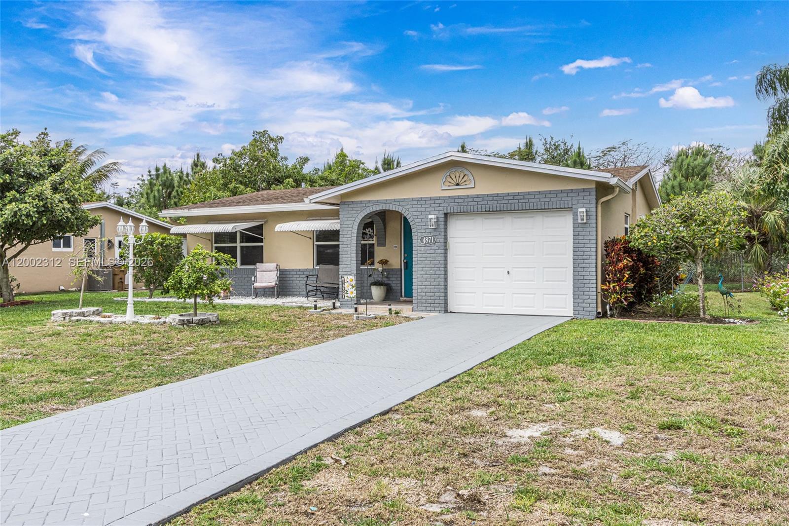 ALL AGES!!!  Brand new roof to be installed prior to closing. Seller's lender offering free 1-0 rate buy down. (Enquire for more information) Charming home in the Crystal Lakes area of Deerfield Beach. This home is a short distance from great restaurants and shopping, the highway and turnpike, West Palm or Ft Lauderdale airports, and is only a short drive to the beautiful Atlantic Ocean, in other words, centrally located in literal paradise!!! This home features impact windows and shutters,updated kitchen, floors,an enclosed Florida room which can be used as extra living space!!! This fantastic neighborhood includes amenities such as a pool, gym,  sauna, jacuzzi, game room, library, and auditorium for gatherings and shows. Affordable Florida living, get your foot in the door with this one!!!