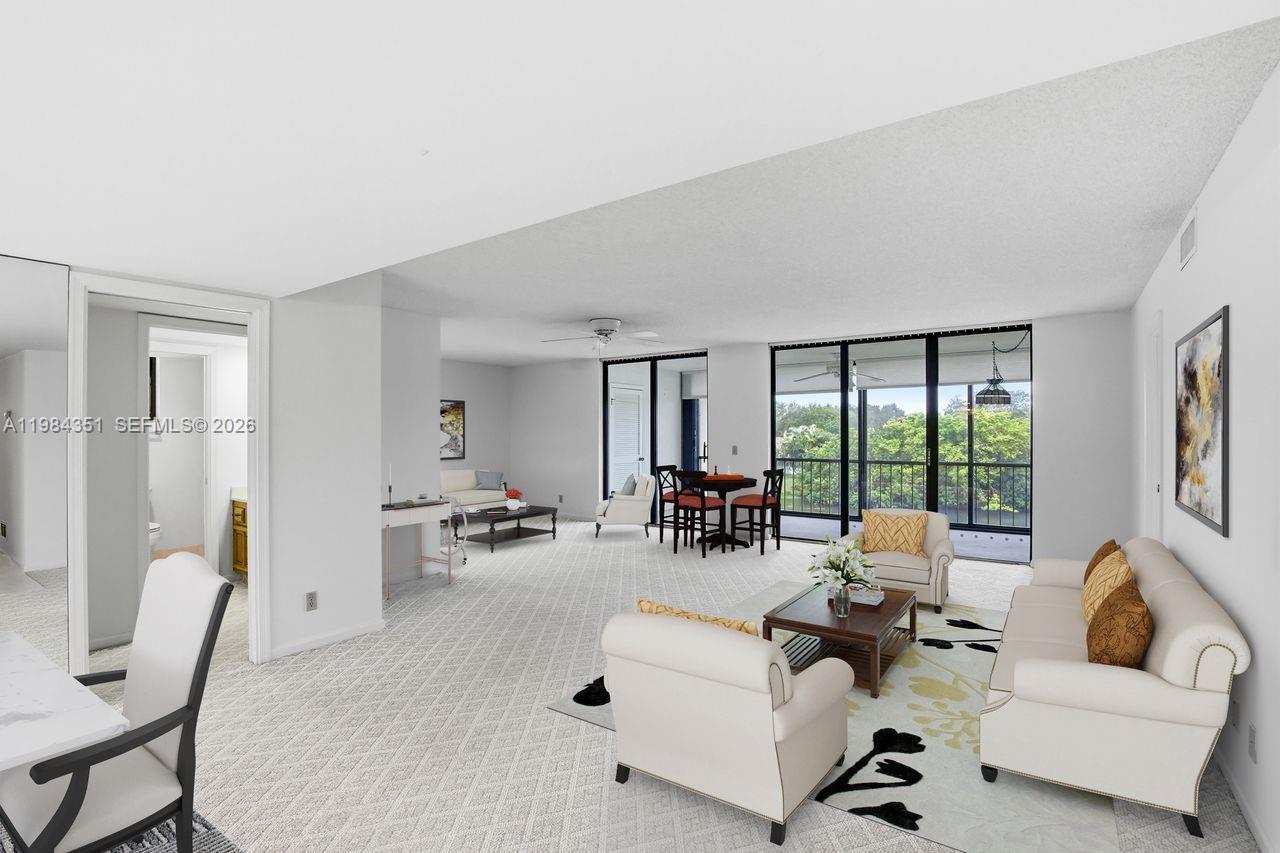 Price Improvement!! A blank canvas in this spacious top floor end unit. Bright natural light and a huge porch bring the outside in with expansive lake views. This unit has a unique larger living area with optional space to add a home office, 3rd bedroom or additional entertaining space. Located in the 55+ community of Woodland Lakes with secure building and lobby. Plenty of storage with 3 separate storage areas. Enjoy access to pools, tennis and pickle ball courts in the community and easy access to great restaurants, shopping, golf courses, 95 and PBIA. Pet friendly with restrictions. Rentals allowed with restrictions.