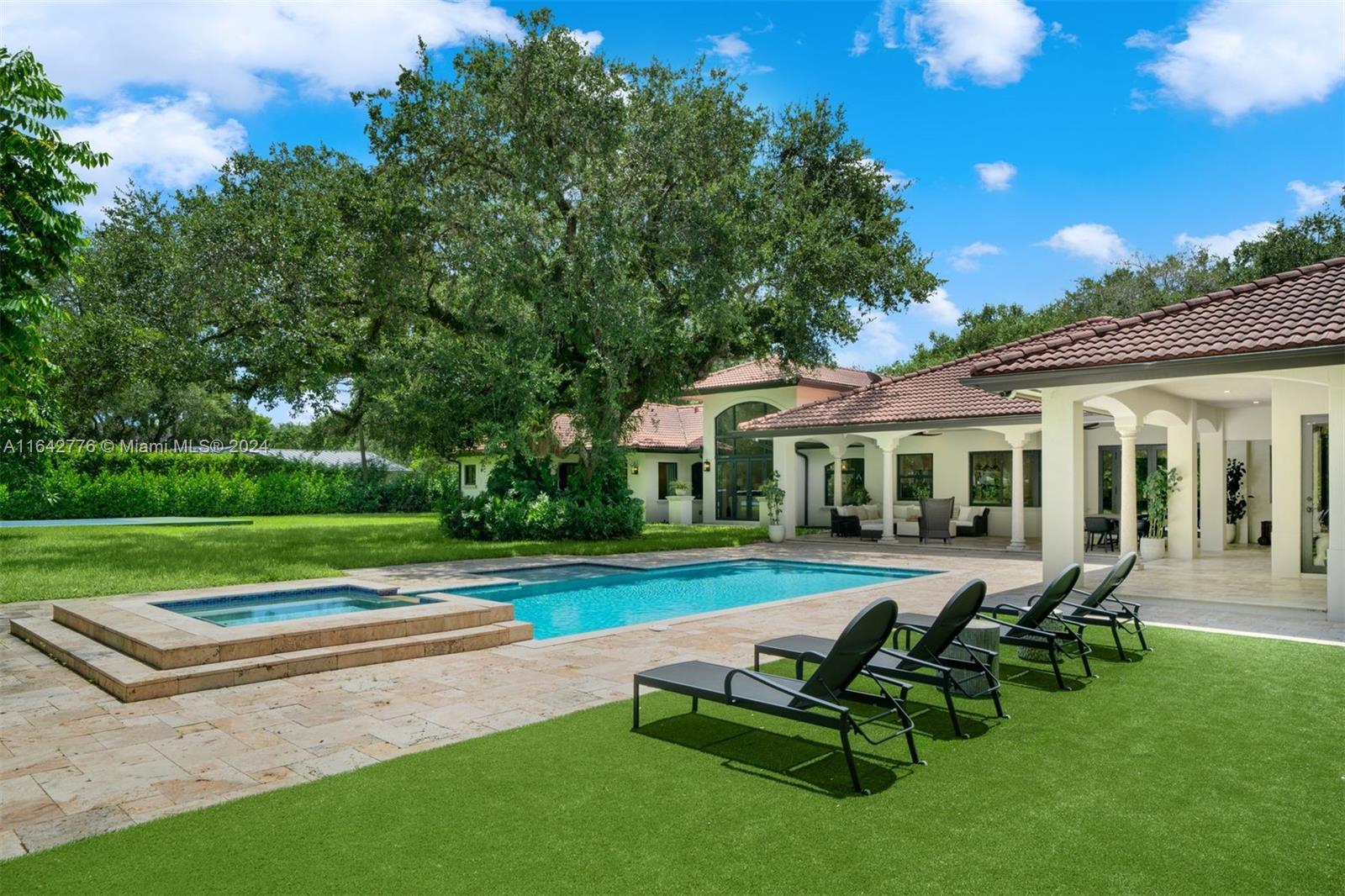 Located on a quiet tree-lined street, the 6-BD, 7.5-BA residence offers a sizable 6,628 SF layout on a beautifully landscaped 36,373 SF lot near Baptist Hospital. Upon entry, one is greeted by triple-height coffered ceilings and plenty of natural light. A gourmet kitchen boasts Taj Mahal quartzite countertops, custom floor-to-ceiling cabinetry, center island, and luxury appliances including a 6-burner industrial Wolf gas stove. Additional features include an insulated 3-car garage with epoxy flooring and AC, impact windows/doors, whole house generator, insulated attic, and Savant smart home system. The beautiful backyard offers a new cabana with full bath, wet bar, recreation room, a sparkling saltwater pool w/waterfall jacuzzi, pickleball/basketball court, and playground area with turf.