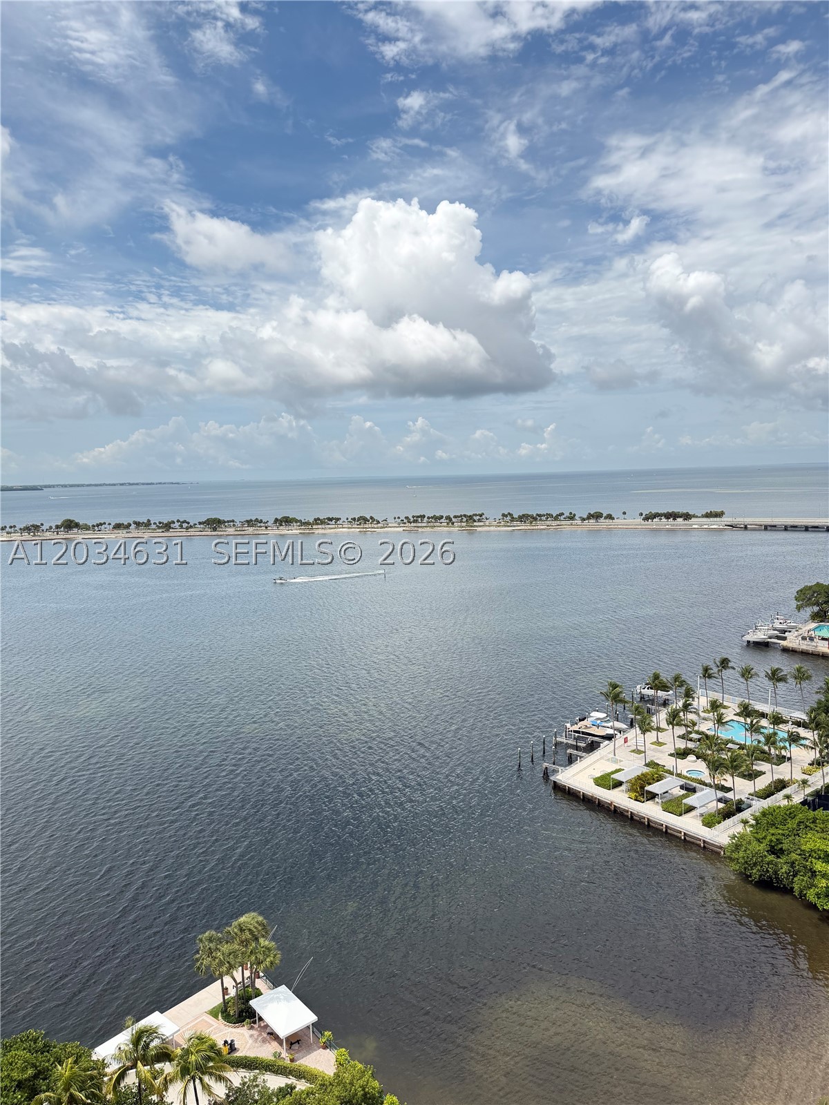 Enjoy breathtaking water views from every room in this beautifully renovated 2-bedroom, 2-bath residence. Thoughtfully designed with sleek built-in storage throughout, this light-filled home features an open-concept kitchen, spacious living areas, a walk-in closet, and an oversized balcony perfect for relaxing or entertaining. 

Residents enjoy an impressive array of amenities, including a fitness center, BBQ area, indoor children's playroom, outdoor playground, tennis, pickleball, and basketball courts, electric vehicle charging stations, on-site market, hair salon, gated parking, complimentary guest parking, bike rack room, paddle board and kayak storage, new XL inifinti pool with open cabanas, Hot tub, kids pool, 24-hour guarded gate access, and fully fenced grounds.

For boating enthusiasts, a private boat slip is available for rent at an additional cost, accommodating vessels up to 36 feet and offering water and electric service at the dock.

Available furnished for an additional fee. This is waterfront living at its finest with unmatched convenience and amenities.