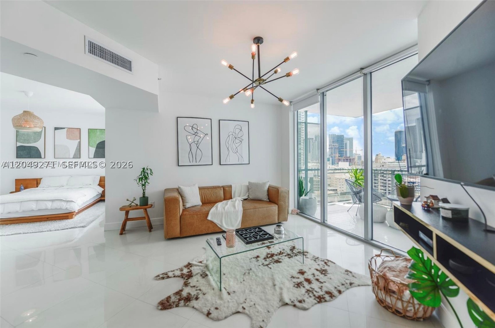 Welcome to Wind, one of Downtown Miami's standout riverfront communities, perfectly positioned between Brickell and Downtown along the Miami River. This bright, move-in-ready residence features an open-concept layout, floor-to-ceiling windows, a private balcony with skyline and river views, an in-unit washer and dryer — and can be rented either furnished or unfurnished to fit your needs. The Riverfront Community is a 13.5-acre fully gated waterfront community, the building offers resort-style amenities including a riverfront infinity pool, jacuzzi, two-story fitness center, indoor racquetball court, meditation garden, sauna, kids' playroom, sports lounge, plus 24-hour valet parking, concierge, and security. Right downstairs you'll find everyday conveniences including coffee shops and market/deli — all just an elevator ride away. The location is unbeatable: steps from the Third Street Metromover station, a short walk to Brickell City Centre and Mary Brickell Village, and surrounded by the best dining, shopping, and nightlife Downtown and Brickell have to offer. With quick access to I-95, you're roughly 5 minutes to Brickell, 15 to Miami Beach, and 20 to Miami International Airport. Turnkey, connected, and in the heart of it all.