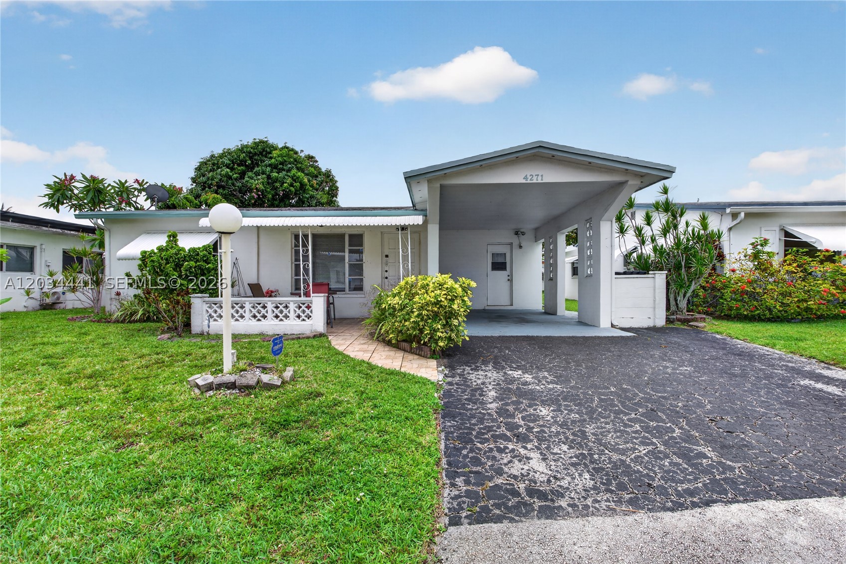 Welcome to this charming 2BR/2BA home located in a well-kept 55+ community. This home can easily be converted to a 3rd bedroom.  The property offers a modern open kitchen, ideal for entertaining and everyday living. This well-maintained unit offers a spacious layout with abundant natural light, an open living and dining area, with a front porch to sit out and enjoy your morning coffee perfect for relaxing. Comfortable living space and well-sized bedrooms. Residents enjoy a quiet setting with access to community amenities and easy proximity to local conveniences. Conveniently located near shopping, dining, and major roadways. Association requires at least one occupant to be 55+. A great opportunity for comfortable and affordable South Florida living! Perfect for buyers looking for comfort, simplicity, and a low-maintenance lifestyle.