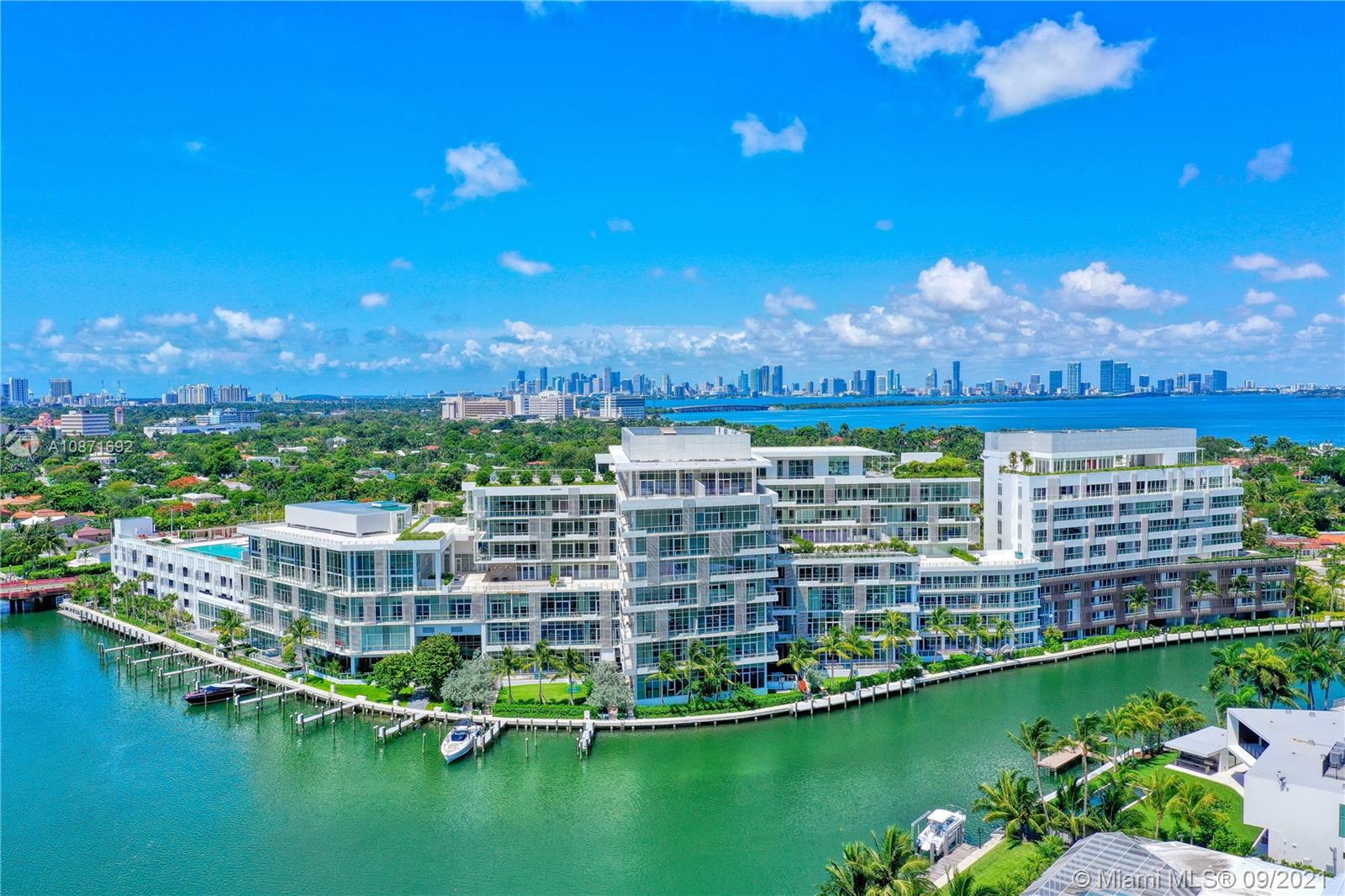 Completely finished!!!Something Unique!!! Water views & Terraces! This is not a developer unit! Private elevator and foyer. This 3-bedroom corner residence boasts walls of glass embracing natural light throughout expansive living spaces, a wraparound balcony and 1,474 SF terrace w/plunge pool overlooking Surprise Lake & Miami Beach. Exquisitely finished with Italian Olivari built in master closet, recessed lighting, stone and wood flooring, Boffi kitchen/ with gas cooktop, pantry, wine cooler, Gaggenau appliances, sound/music system, remote drapes & black outs. Zucchetti fixtures. Full-service building managed by The Ritz-Carlton and amenities including a marina, spa, rooftop restaurant and pool. 5* Amenities.