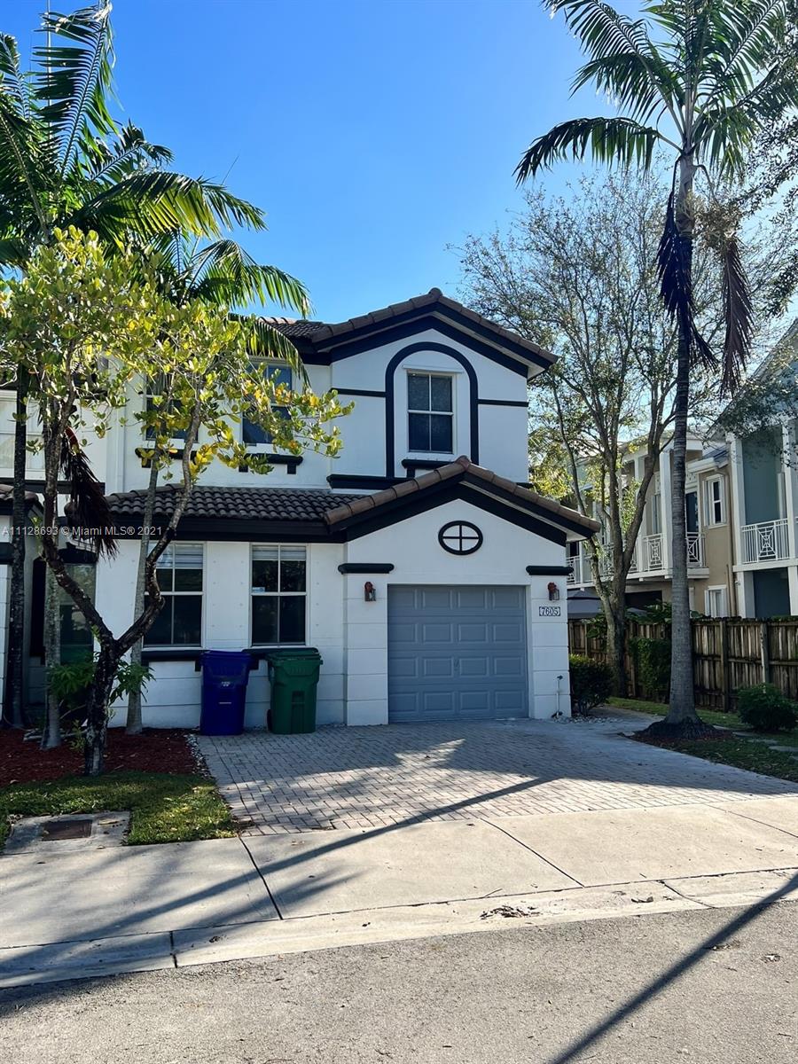 Beautiful and cozy corner unit at Island of Doral (Windward). 3 bedrooms/2.5 bathrooms townhouse, Master Bedroom/Bath downstairs. Recently renovated, freshly painted, granite counters, stainless steel appliances, wood laminated stairs, ceramic floors. A charming fenced patio, plenty of natural light. One car garage, plus 2 car spots in front of the house. Excellent location close to the Turnpike, Shopping, Restaurants, Community Parks, and A+ Schools. Playground and pool in the condominium, plus membership to the "Islands at Doral Club House" (pool, jacuzzi, tennis and basketball courts, gym). Lockbox at the property. Text listing agent for showing information.