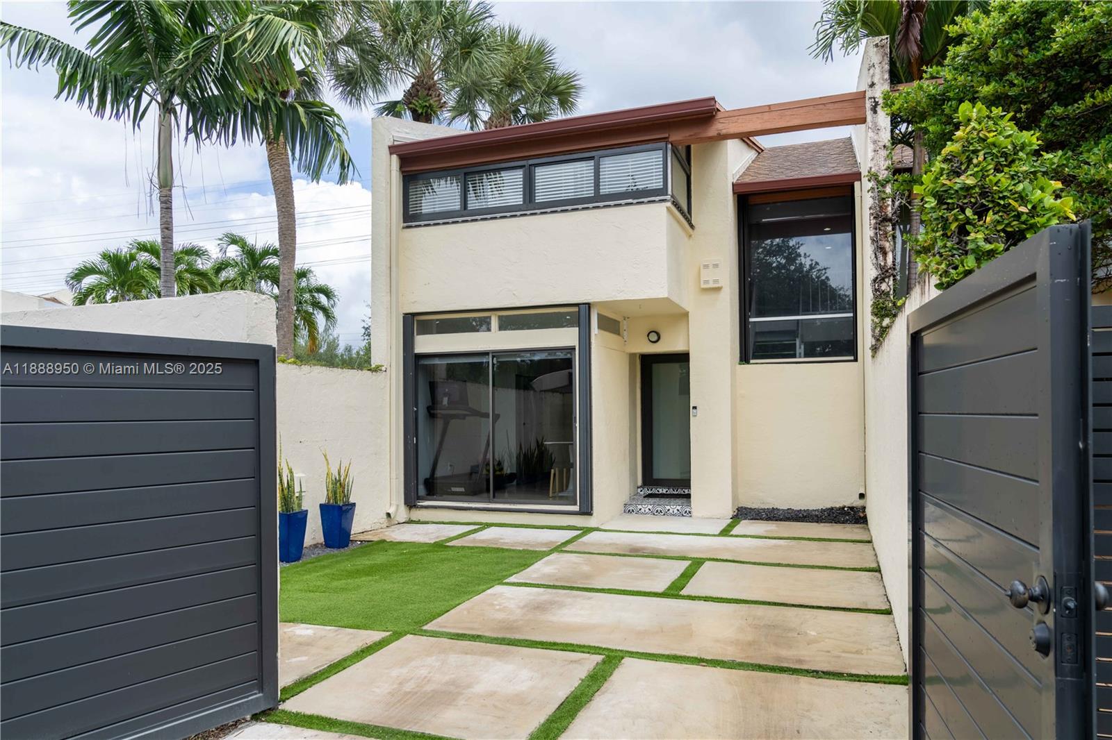 Rare oversized corner-unit townhouse in Kendalltown! This updated 3BR/2.5BA home features an open layout, remodeled kitchen with granite counters, and premium appliances. The spacious primary suite offers a renovated bath and large closets, with two versatile bedrooms upstairs. Enjoy peace of mind with a new roof (2020), new A/C (2024). The private gated driveway and travertine patio open to a lush green space your own park! Resort-style amenities include a clubhouse, pool, gym, and tennis courts all with a low HOA in a community known for pride of ownership and charm.