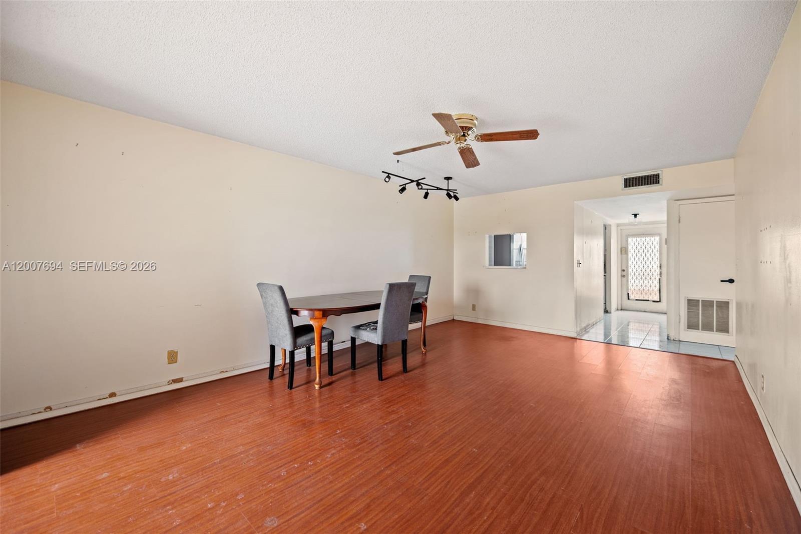 Start your day with tranquil lake views in this bright and spacious 2-bedroom, 2-bath condo. It includes an assigned parking space and offers comfortable living within a vibrant 55+ community. Opportunities priced well like this are hard to find. Enjoy an impressive selection of amenities including a clubhouse, fitness center, multiple pools, theater, ballrooms, library, tennis courts, and even a golf course. Priced to sell, this unit offers great bones and presents an excellent opportunity for a buyer to renovate, update, and truly make it their own. Ideally located just minutes from Sawgrass Mills Mall, with easy access to shopping, dining, and everyday conveniences—this is a fantastic value with tons of potential.