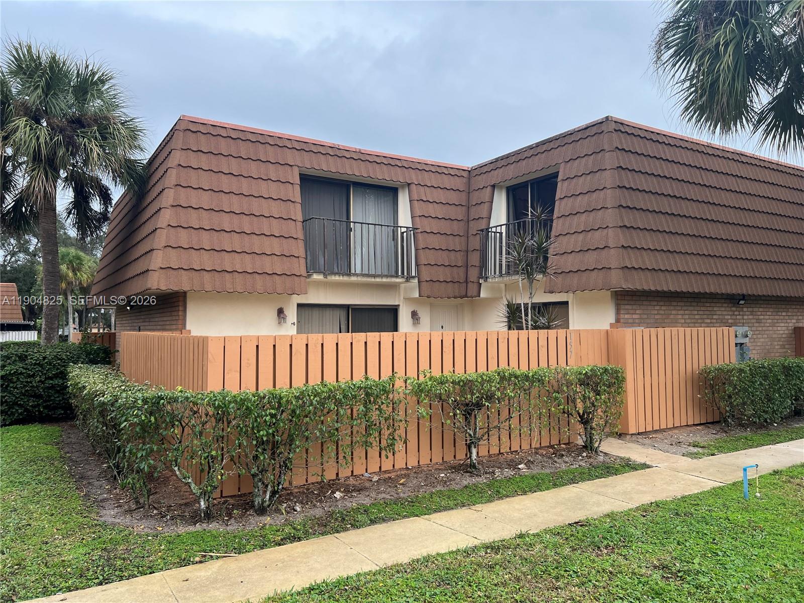 Enjoy tranquil lake views from this charming 2-bed, 2.5-bath townhouse featuring two stories of comfortable living space and a spacious private backyard. Bright and airy layout with separate living and dining areas. Bedrooms upstairs include a cozy balcony overlooking the lake. Upgrades: new washer, water heater, and A/C (all 2024). Located minutes from I-95, shops, and entertainment. Community amenities include pool, playground, and tennis courts. HOA covers cable and internet. Two assigned parking spaces. Recently upgraded fencing adds privacy. Excellent home or investment.