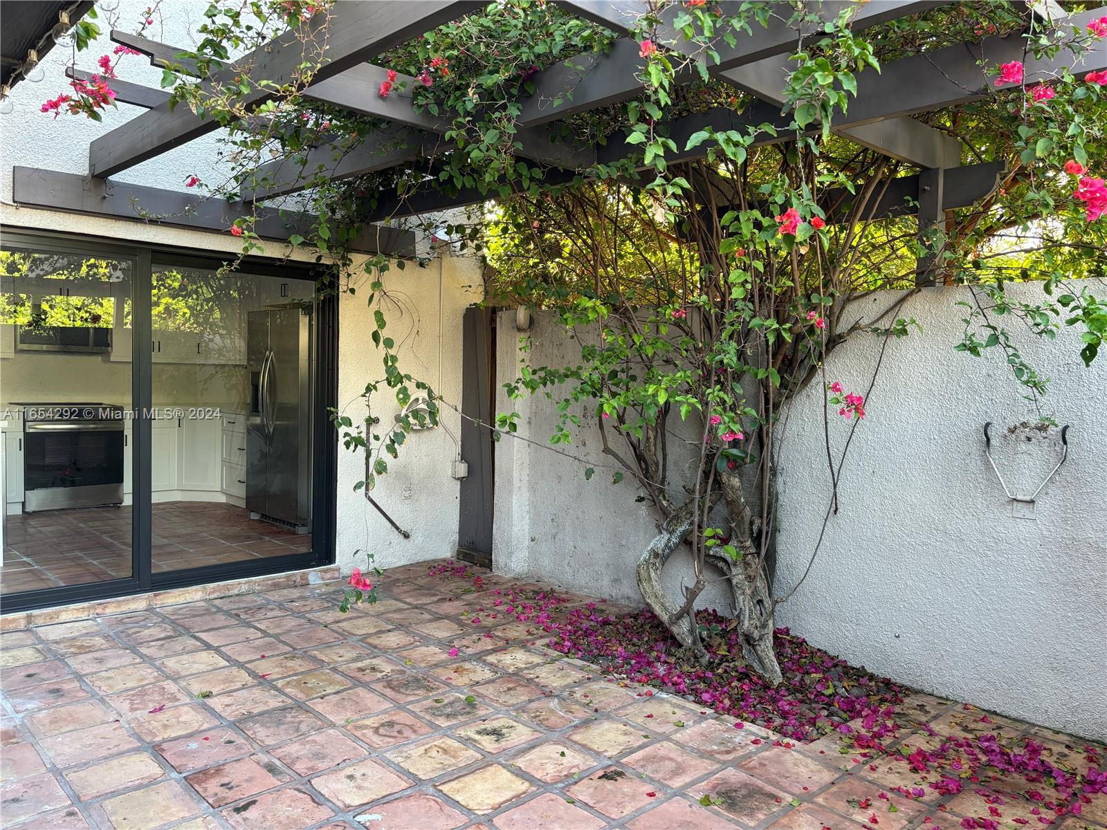 Discover your urban oasis in the heart of South Miami, nestled on the fringe of the prestigious Coral Gables. This exquisite rental in the serene community of The Oasis presents a rare gem: a condo that feels like a home. Experience luxury living with a fully updated kitchen, perfect for culinary enthusiasts, and unwind in your private patio adorned with vibrant bougainvillea. This two-bedroom retreat goes beyond expectations with a dedicated laundry room, elevating convenience in condo living. Revel in the tranquility of the community pool and lush walkways, offering a peaceful escape. Welcome to your Oasis—where comfort meets sophistication.