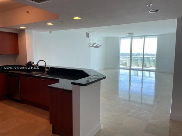 Incredible water view!! Best line in the building. Corner unit with all the bedrooms (3) in suite with windows in all bedrooms and bathrooms. Italian kitchen with SS Appliances. New Laundry (cabinets, washer and dryer). New Central AC. New floors in bedrooms and walking closets (laminate water resistant and anti scratches). Amazing Sunrise view in the Ocean from the balcony and Master bedroom; and amazing Sunset views in the city from the bedrooms 2 and 3. Rent includes internet, cable and home phone. A fantastic pool, great club room with pool table , ping pong table, refrigerator, TV system, and all you need to enjoy with your family and friends. Piece of art GYM. Two play grounds for the kids. Tennis court. Covered assigned parking. Valet parking. YOU MUST SEE IT!!!!