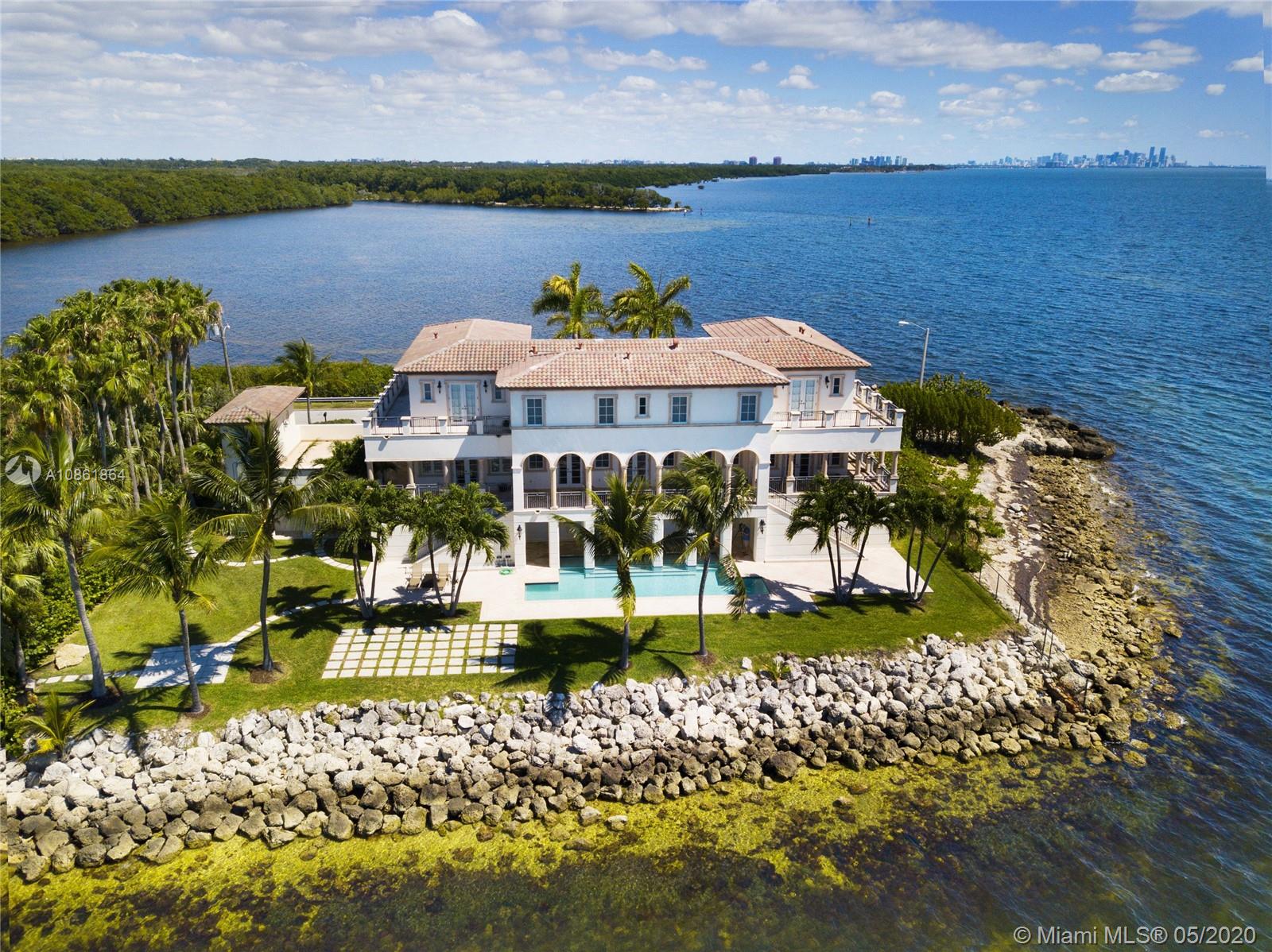 Stunning Palladian style bay front estate commanding the best location in the gated community of Gables By The Sea. Breath-taking views of the bay from the spacious living areas, gourmet eat-in kitchen with top quality appliances, split floor plan with a private balcony access from each bedroom, impressive master suite, marble, wood and slate flooring, open roof top terrace, heated pool, lush landscaping and 2 car garage. New owner can build a dock at this property.