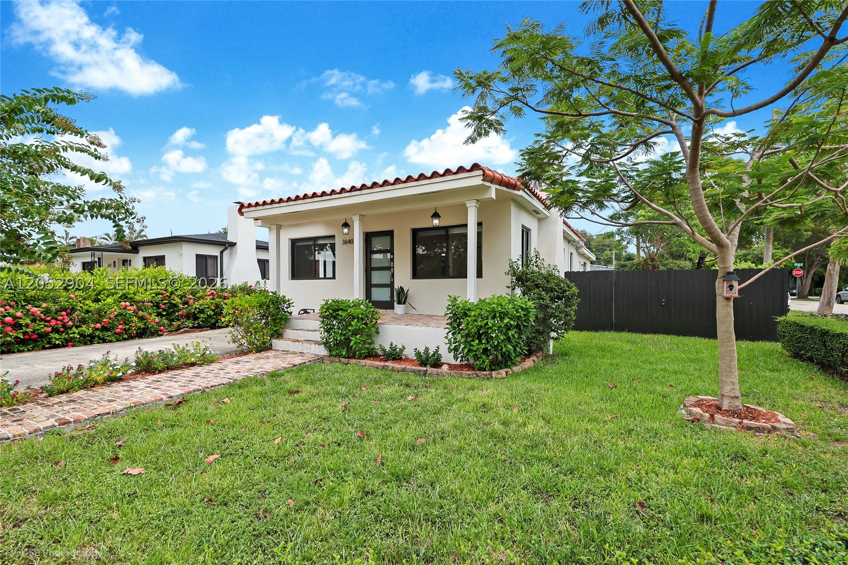 This beautifully maintained 3-bedroom, 2-bath residence offers a perfect blend of comfort, character, and modern updates. Featuring updated kitchens and bathrooms, the home is thoughtfully designed with spacious living areas, including a large family room ideal for entertaining, relaxing, or creating a flexible workspace.
Beautiful wood flooring throughout, along with a cozy fireplace that adds a welcoming touch to the living space. The home’s inviting curb appeal is enhanced by a beautiful front porch finished with classic Chicago brick, creating a timeless entrance.
The fenced-in yard provides privacy and outdoor enjoyment, perfect for gatherings, pets, or simply relaxing in your own private space. Situated in a highly desirable central Miami location, this corner property offers convenient access to dining, shopping, schools, major roadways, and all that Miami has to offer.