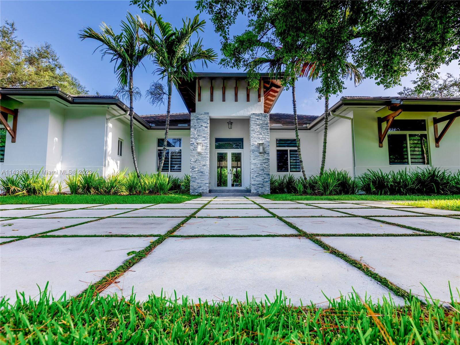 Beautiful Pinecrest residence with 5 bedrooms and 6.5 baths with the perfect blend of elegance and modern luxury. Located on an ample 38,768 sq ft private lot, the outdoor areas are perfect for hosting friends/family gatherings.
Complete with sparkling pool and spa, ample gazebo with summer kitchen and expansive covered patio areas.With all en suite bedrooms, this home features a sleek, open floor plan. The chef's kitchen is conveniently adjacent to the light filled family room, offering an expansive view of the outdoors.Unique details like coffered ceilings and custom cabinetry throughout. And, let's not forget the practicalities: spacious laundry room and a three-car garage. This home isn't just a property, it's the epitome of Miami luxury living. Also for rent #A11441035