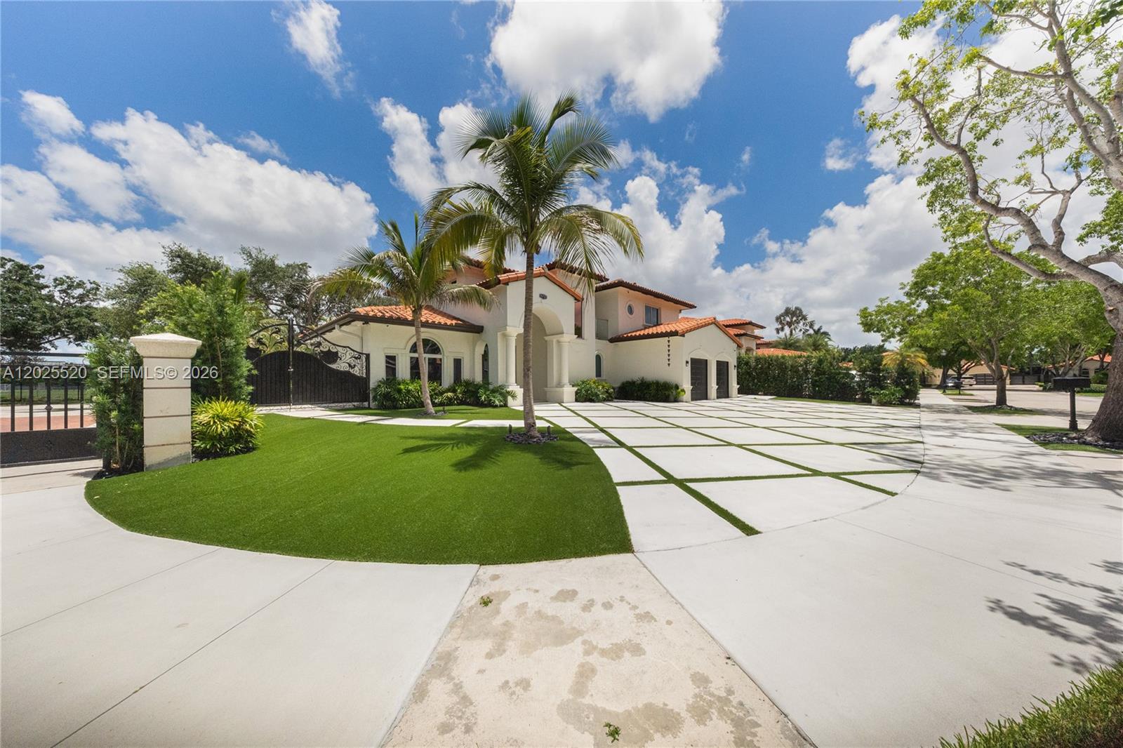 Behind the gates of Silvercrest Lake Estates, this 5-bedroom, 4-bath residence delivers 3,093 SqFt of refined living in one of Miami Lakes’ most sought-after guard-gated communities. The chef’s kitchen features Italian cabinetry, a quartz center island, and an eat-in space built for everyday living and entertaining. Step outside to a private backyard retreat with a heated saltwater pool and spa, plus a tiki hut with full outdoor kitchen and built-in grill. Inside, volume ceilings, marble and tile floors, custom built-in closets in every bedroom, and a spa-style Roman tub elevate the experience. Impact windows and doors, newer A/C, and security cameras add peace of mind. A circular driveway and 2-car garage complete the package. Built on a 9,507 SqFt lot with curved S-tile roof and concrete block construction. Minutes from top-rated schools, Miami Lakes Golf Club, and Main Street dining .