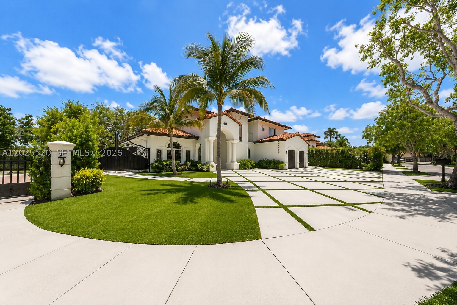 Behind the gates of Silvercrest Lake Estates, this 5-bedroom, 4-bath residence delivers 3,093 SqFt of refined living in one of Miami Lakes’ most sought-after guard-gated communities. The chef’s kitchen features Italian cabinetry, a quartz center island, and an eat-in space built for everyday living and entertaining. Step outside to a private backyard retreat with a heated saltwater pool and spa, plus a tiki hut with full outdoor kitchen and built-in grill. Inside, volume ceilings, marble and tile floors, custom built-in closets in every bedroom, and a spa-style Roman tub elevate the experience. Impact windows and doors, newer A/C, and security cameras add peace of mind. A circular driveway and 2-car garage complete the package. Built on a 9,507 SqFt lot with curved S-tile roof and concrete block construction. Minutes from top-rated schools, Miami Lakes Golf Club, and Main Street dining .