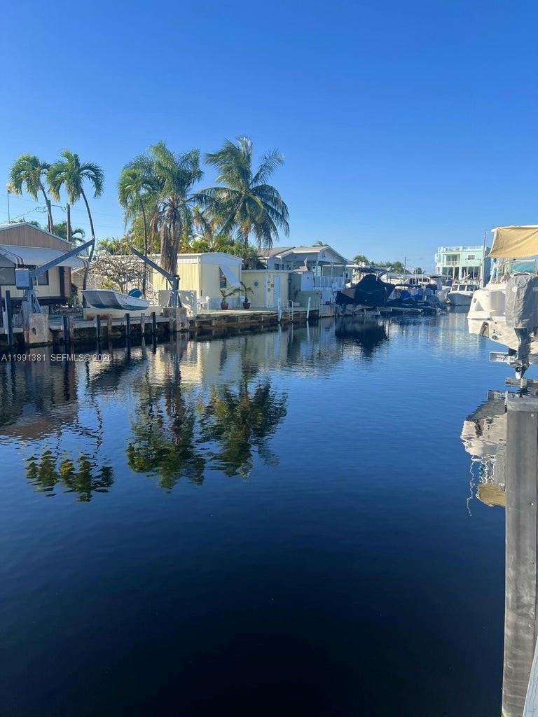 Welcome to your Keys waterfront escape in Key Largo. Located on a wide canal with no bridge access to open water, this property is ideal for boaters seeking quick and easy access to the bay.
Enjoy 45 feet of concrete dockage on a 55' wide canal with approximately 5' control depth. This property is designed for relaxing and entertaining, featuring a tiki hut, outdoor cooking area, and a private 6-person spa, perfect for enjoying the Florida Keys lifestyle.
The home features a comfortable, updated interior with impact-resistant windows and doors, tile flooring, and a metal roof. Whether you're looking for a weekend getaway or a full-time residence, this property delivers a unique opportunity to own waterfront in Key Largo at an attractive price point.
Conveniently located near shopping, dining, and just minutes to open bay waters.  Plenty of parking space. Located 3 minutes away from the Winn-Dixie grocery store. Beautifully decorated and ready to enjoy. AND ONLY 23 MINUTES FROM HOMESTEAD/MIAMI! 
También hablo español.

 This is a cash transaction.