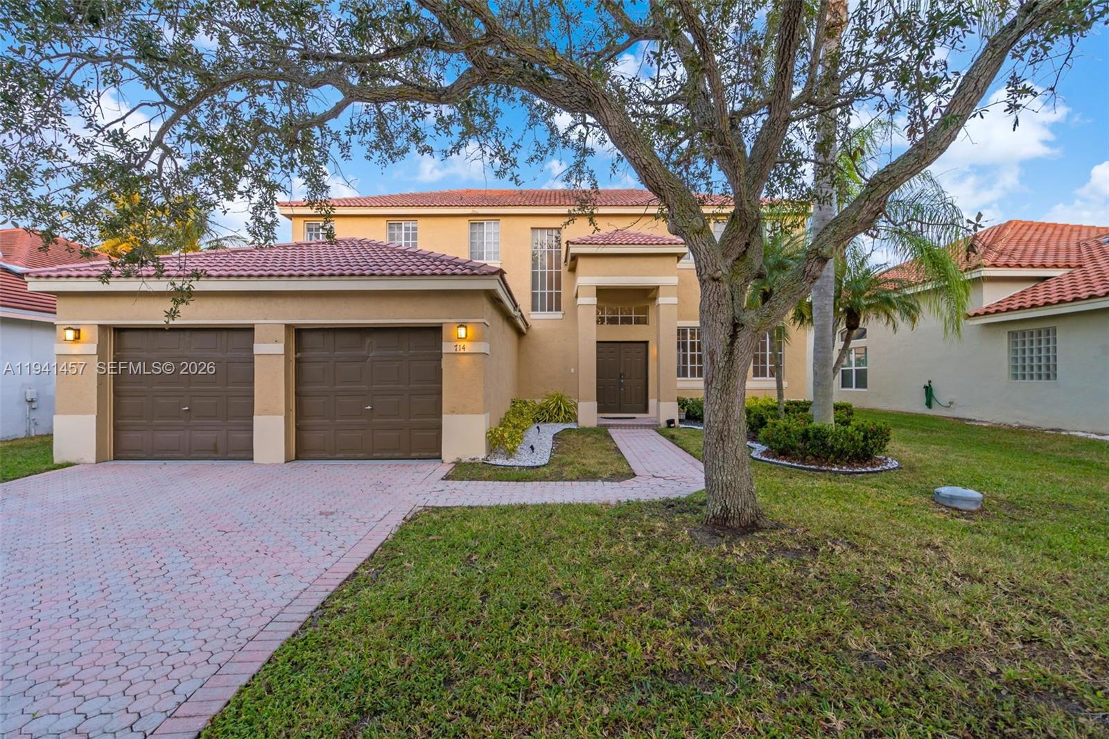 Spectacular lakefront living in Weston. Welcome to 714 Heritage Dr, a beautifully renovated two-story 5-bedroom, 3-bath residence offering 2,860 sq ft of bright, open living space plus a 2-car garage. 
Enjoy the ultimate Florida lifestyle with a screened-in pool overlooking tranquil lake views, ideal for entertaining or unwinding at the end of the day. 
Inside, the home shines with thoughtful upgrades: new kitchen and bath cabinetry with soft-close doors, granite countertops, stainless-steel Samsung appliances (including washer/dryer), 24x24 porcelain tile throughout the first floor, new carpeting upstairs, and LED lighting throughout. 
A sunlit breakfast area with a bay window captures the water views and brings in abundant natural light, while the spacious primary suite provides a comfortable retreat. 
Located in a sought-after gated community with amenities and access to high-performing Weston area schools (buyer to verify enrollment/assignments). 
City of Weston
Schedule your private showing—this lakefront home is a must-see.