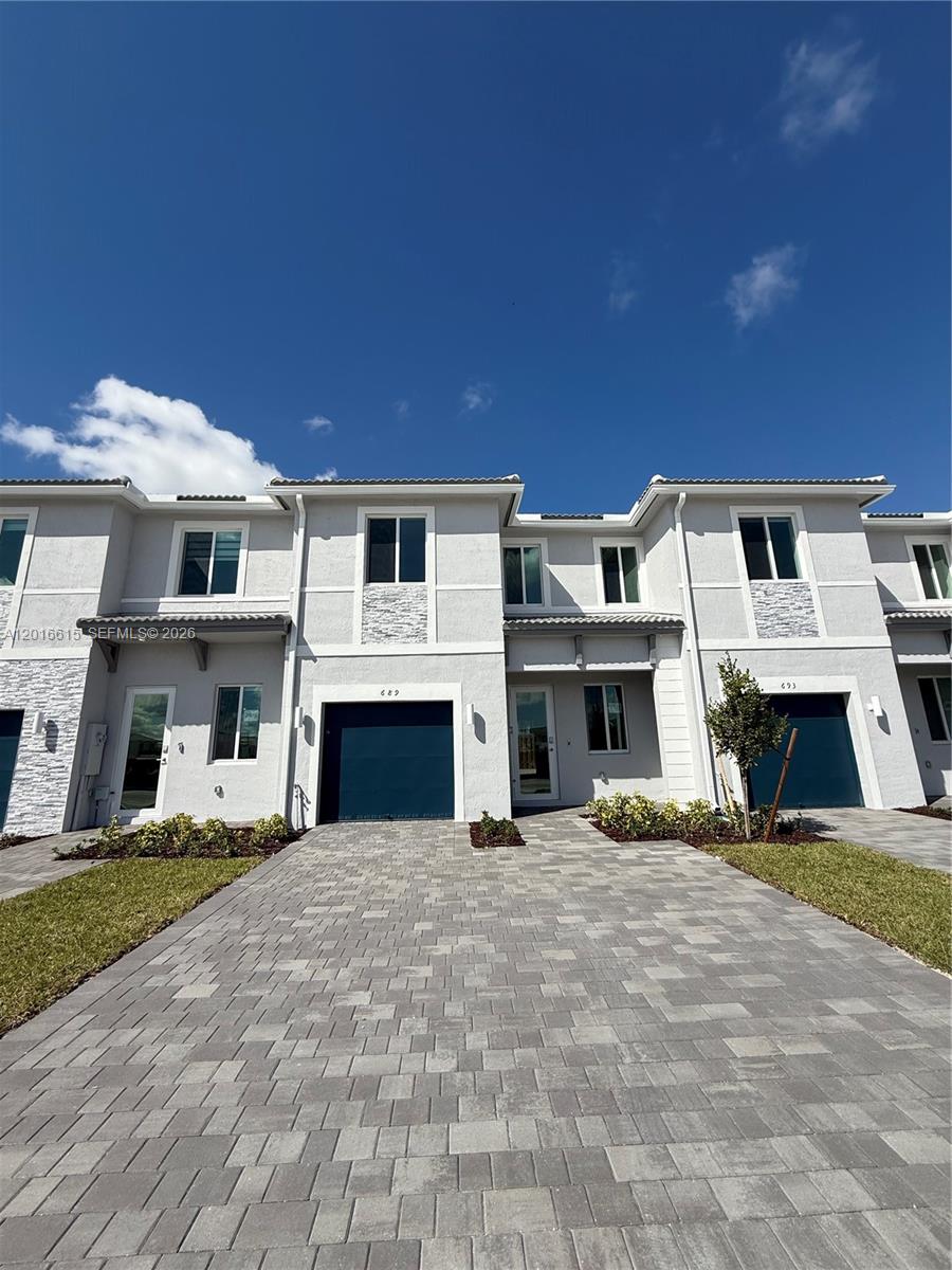 NEARLY-NEW RESIDENCE IN TERRA SOL. This impeccably maintained 2024-built townhouse offers a rare opportunity to own a "like-new" home without the developer's wait. Spanning 1,742 adjusted square feet, the residence features a contemporary open-concept layout with high ceilings, ceramic tile flooring, and premium finishes throughout. The chef-inspired kitchen is equipped with stainless steel appliances, granite countertops, and designer cabinetry.

Located within the secure, gated community of Terra Sol, residents enjoy access to a resort-style Clubhouse, a fully-equipped fitness center, a sparkling swimming pool, and dedicated recreation areas. Strategically positioned in Homestead with immediate access to the Florida Turnpike, Baptist Health, and the Florida Keys.