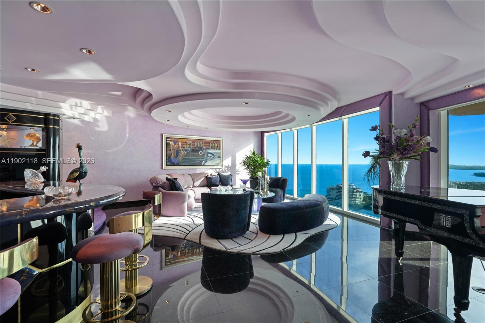CASA DISCO IN THE SKY ~ HIGH-GLAMOUR ART DECO REVIVAL WITH WRAPAROUND UNOBSTRUCTED VIEWS OF THE CITY, OCEAN & BAY BY ARNOLD SCHULMAN AT THE NEWLY RENOVATED PORTOFINO TOWER IN SOUTH OF 5TH STREET NEIGHBORHOOD! 2-Story TH with Private Elevator Entry into 5,450 SF Interior Living Space + Terraces with 3 Bedrooms + 4 Baths + 2 Powder + a 600 SF Disco Room with Rolls-Royce inspired Starlight Ceiling & Direct Skyline views. Living area with Bar + Black Lacquer Media Room with Sunrise & Sunset views. Black Galaxy Granite flooring & Cloud-like Curved Ceilings. Primary Suite in Mirrors & Velvet with Oversized walk-in Wardrobes + Huge Primary Bath with double sinks, soak-in tub & shower. Office in Zebra Wood with en-suite Bath. Service Suite with full bath. 3 Parking + Storage Room + storage unit.