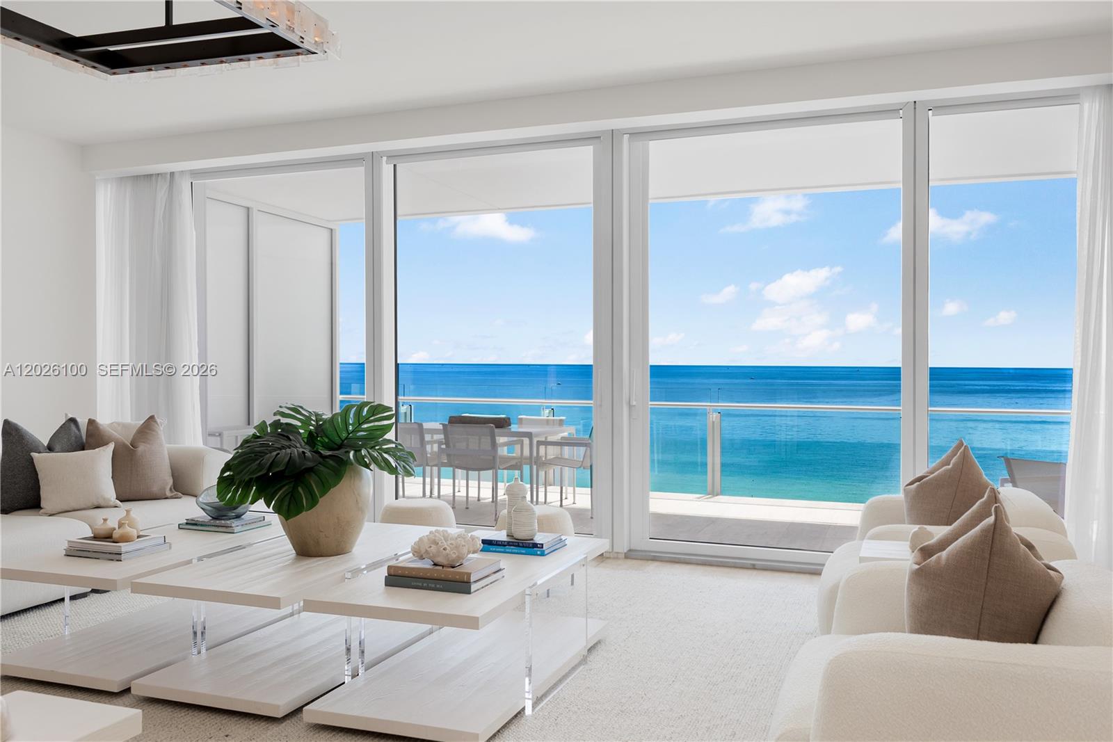 Experience unmatched luxury at The Surf Club Four Seasons in this extraordinary flow-thru residence offering approximately 4,640 SF with 4 bedrooms, 5 full baths, and 1 powder room. Perched on a high floor, under Penthouse level. This ultra-private residence features direct private elevator entry and breathtaking unobstructed Atlantic Ocean and shoreline views from sunrise to sunset. Expansive terrace seamlessly blend indoor and outdoor living. Designer finishes throughout are complemented by integrated Lutron lighting, Leviton smart-home technology, and Savant automation systems. Enjoy legendary Four Seasons services and world-class amenities including private beach service, multiple pools, spa, fitness center, concierge, valet, and Michelin-star dining within one of the most sought-after oceanfront addresses in the world. High-profile security services throughout. Until has staff-quarters with seperate private entrance. One of the world's most sought after addresses.
