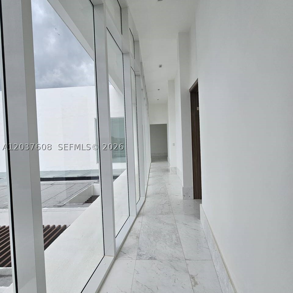 Modern and minimalist villa with ocean views in Cap Cana

Impressive luxury villa with a modern and minimalist design located in one of the most exclusive areas of Cap Cana, Dominican Republic. The property is designed to maximize natural light and ventilation, creating fresh, spacious and elegant spaces.

It has 7 large bedrooms, 8.5 modern bathrooms, elegant hall, formal dining room, living room, wine cellar, bar and a spacious wine cellar. It also has a fully equipped cold kitchen and hot kitchen.

The villa offers 4 balconies with sea views, a main terrace overlooking the Caribbean and an outside terrace ideal for entertaining.

In the outdoor area there is a private pool and jacuzzi, as well as a large garden. The property also includes a laundry area, utility room and carport with capacity for 6 vehicles.