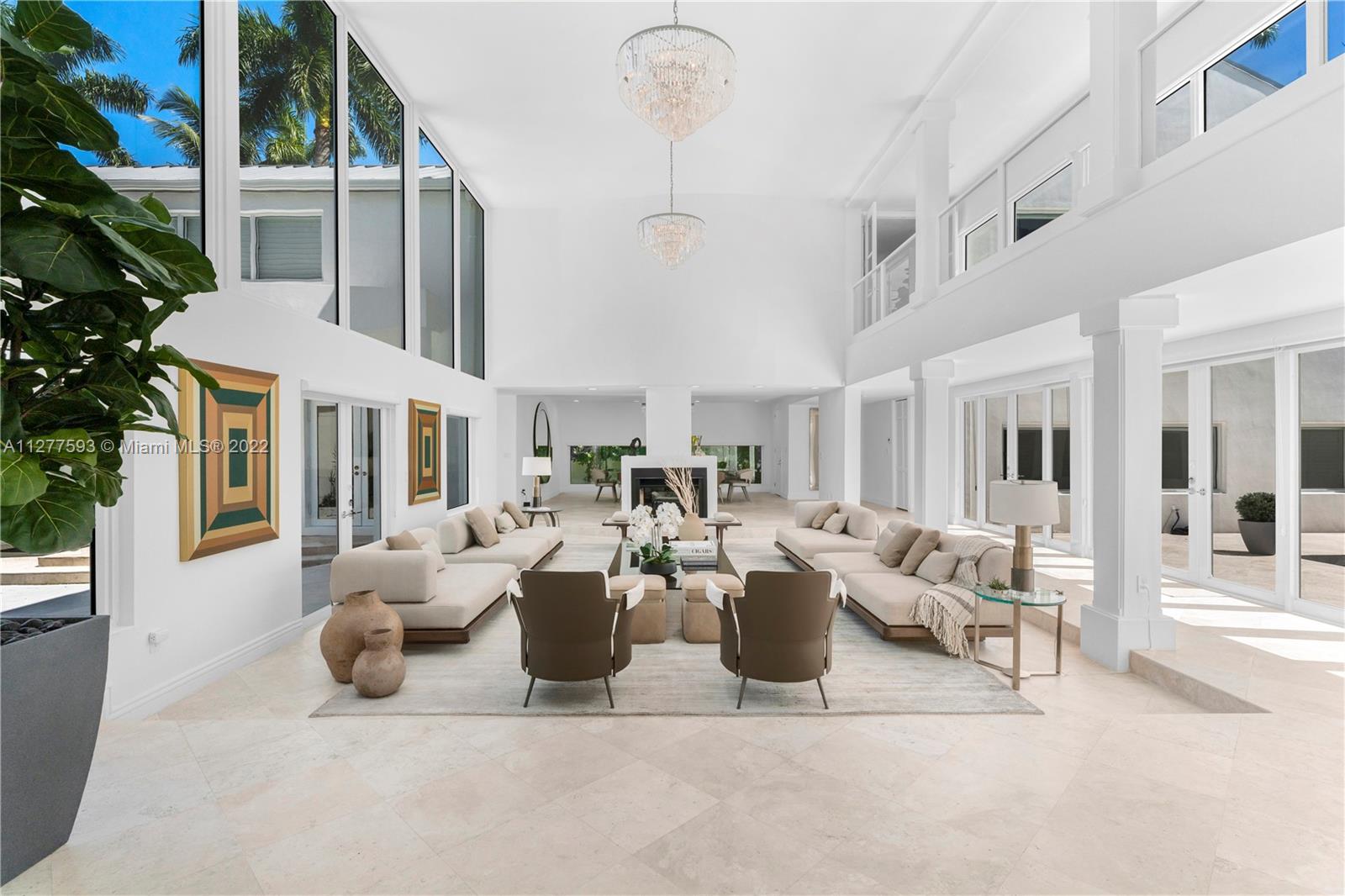 Exquisite home located in the coveted Ponce Davis neighborhood, featuring 8 bedrooms, 8.5 bathrooms, and magnificent living areas. This unique home features a climate controlled wine cellar with 900+ bottle capacity, chef's kitchen, outdoor pavilion with summer kitchen, and heated saltwater pool with Spanish glass tile. Surrounded by lush landscaping and concrete walls, this oasis offers absolute privacy and security. Smart features include ADT Custom Home Pulse (indoor/outdoor cameras, lights, gates, ACs), 40+ solar panels, 2021 60kwt Generac propane generator, 1,250 gallon propane tank, Galvalume roof & PGT impact windows and doors, and electric vehicle charging station. Tastefully staged by Artefacto. Furniture, accessories and artwork available for purchase.