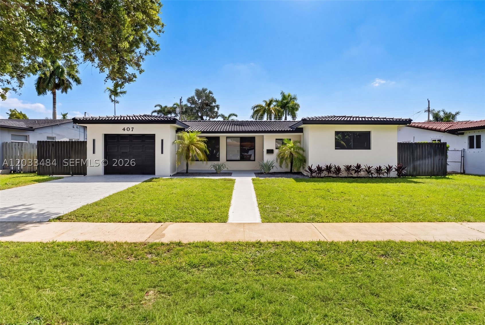 This stunning 3-bedroom, 3-bathroom residence has been totally redone with no expenses spared — a true end-user renovation with high-end finishes throughout.
Be impressed by the open interior showcasing imported 48x48 Spanish porcelain tile and custom LED lighting throughout. The chef's kitchen is a showstopper featuring Taj Mahal quartz countertops, solid wood European cabinetry, and a seamless modern aesthetic. Two primary suites with walk-in closets, including one with a private cabana bath, offer flexible living. Custom cabinetry throughout delivers beauty and function in every space.
Rest easy knowing the big-ticket items are all brand new: PVC plumbing, updated electrical, new tile roof, brand new AC, and modern vents complete the clean architectural look.
Outside, a brand-new 40-foot pergola with lighting and ceiling fan creates the perfect year-round entertaining space. Room to add a pool, a new metal fence for privacy, and a one-car garage complete this exceptional offering.
Minutes from beaches, dining, and top-rated schools. Homes like this don't last — schedule your showing today!