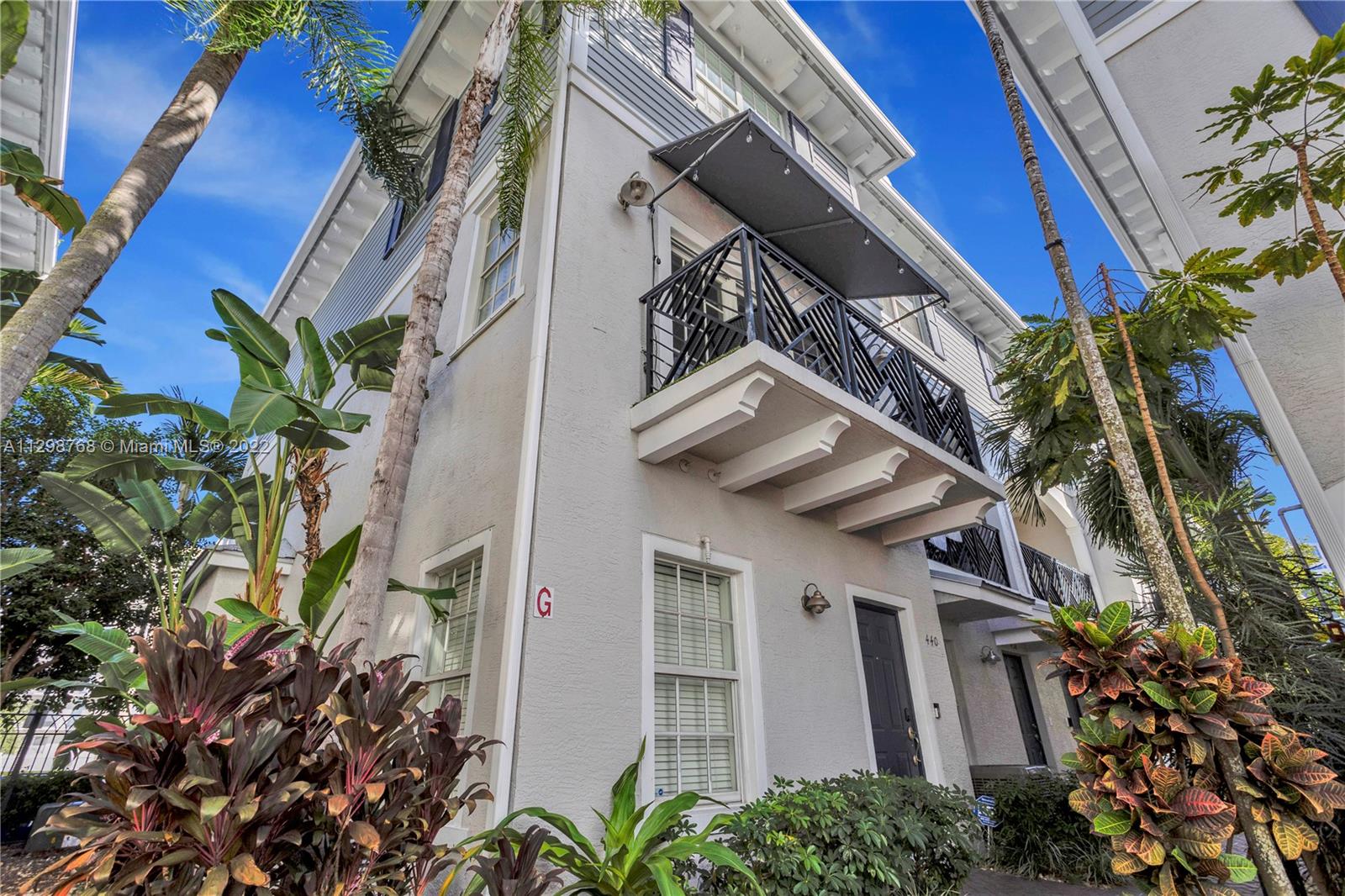 TriLevel 2/2.5 corner townhouse in sought after East Village! Gated boutique community in the middle of Downtown just completed gorgeous makeover w/exterior paint, landscaping, lighting, pavered pool & bbq area. Enter 1sr Flooring leads to 2nd level living area. Granite counters, wood cabinets & SS appliances in kitchen. Dining area w/ fabulous new smart home lighting fixtures. 1/2 bath w/updates. Enjoy coffee on open balcony. 3rd level BR's w/walk in closet & frameless shower in Master. Private bathe & built in closet in 2nd BR. Interior recently painted, Tesla charging station in attached 1CG + 1 outdoor space. Metal Roof 2015. Walk to Las Olas, Arts District Flagler Village & short drive to the beach.
