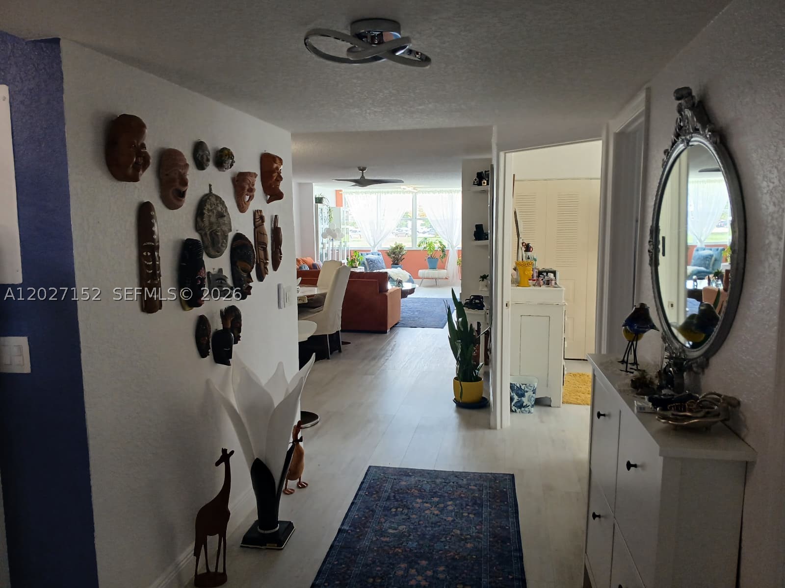 Spacious and beautifully maintained waterfront 3-bedroom, 2-bath first-floor corner unit in the desirable Sunrise Lakes 55+ community! This bright and inviting home features new tile flooring throughout, an updated kitchen with oversized cabinetry and stone countertops open to the dining and breakfast area, plus a dedicated laundry room with full-size washer and dryer and additional storage conveniently located outside the unit. The oversized primary suite offers an XL walk-in closet and serene water views. Extra windows throughout the corner unit fill the home with abundant natural light while showcasing peaceful garden and waterfront views. Enjoy the safety and tranquility of this well-maintained community, offering an impressive variety of amenities including game rooms, live shows and events, clubhouse activities, and a massive movie theater.
