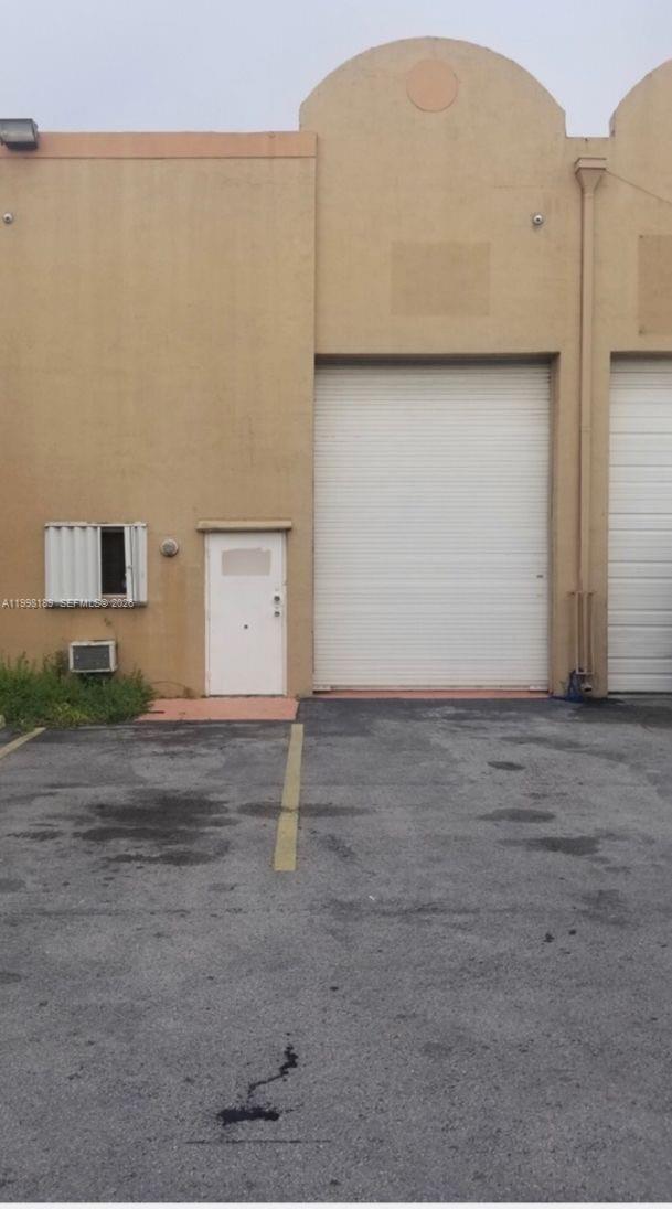 Turnkey 1,300 sq ft two story warehouse flex space completely remodeled and ready for operation. This secure, modern unit features functional private offices, a private bathroom, and versatile open space ideal for light manufacturing, craftsmanship, or professional workspace. Includes 2 assigned parking spaces and security camera system. Perfect for entrepreneurs seeking a high-end, secure location. Affordable $412.00 maintenance fee including everything but eletricity. Post Occupancy agreement for both sides convenience.  2025 property taxes $4,400.