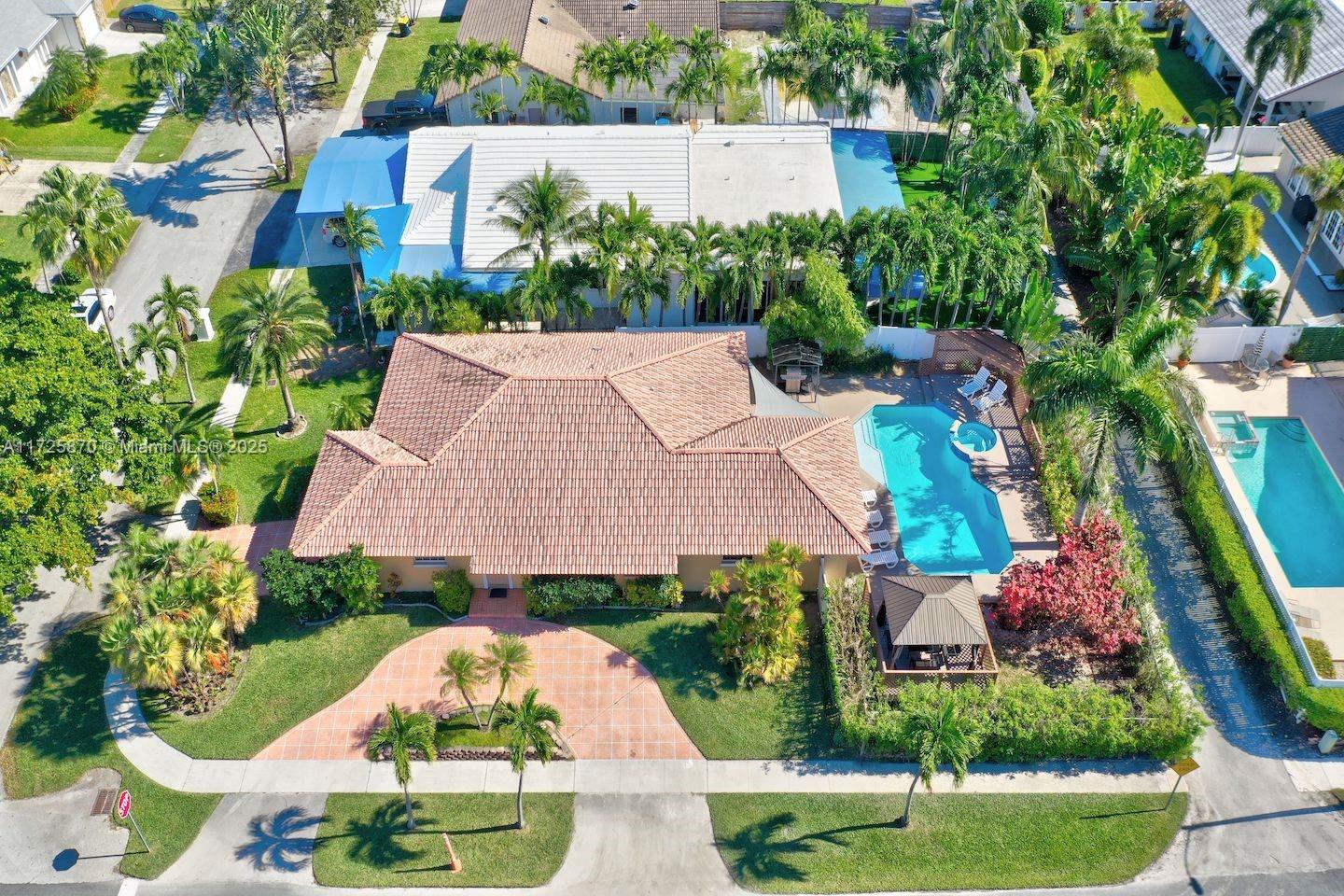 Stunning corner-lot home located in the most upscale part of Dania Beach, offering luxury living and incredible investment potential. This beautifully maintained property features a private heated pool & jacuzzi with a recently installed energy-efficient pool heater, perfect for year-round enjoyment. Situated on a corner lot, the home provides enhanced privacy and abundant outdoor living space. The property boasts 2 driveways, providing ample parking and a charming pergola in the backyard. Fully equipped with short-term rental licenses, this property is ideal for those seeking a lucrative investment or part-time residence. Located minutes from the famous Dania Beach, Hollywood Beach & Boardwalk, the Dania Beach Casino, as well as a variety of restaurants, bars, and entertainment options.