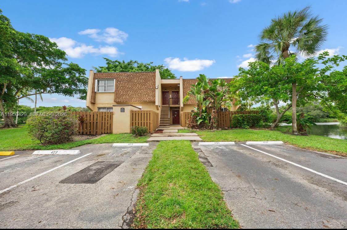 Excellent opportunity for investors or end users! Well-maintained 2-bedroom, 1.5-bath condo in the desirable Origins of Welleby community. This bright unit offers peaceful lake views, beautiful sunset reflections, brand-new flooring, full-size washer and dryer, new A/C (2025), new electric water heater, and newer roof. Located in a quiet boutique-style building with only 4 units per building. Water is included in the HOA. Property includes TWO assigned parking spaces plus private storage. Conveniently located near shopping, dining, schools, parks, Sawgrass Mills, and major highways. Move-in ready, low-maintenance, and investor-friendly. Great opportunity to live in it or rent it right away!