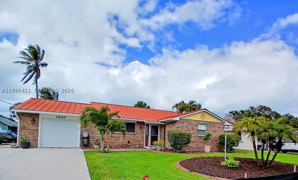 TROPICAL ISLAND LIVING! MILLION DOLLAR LOCATION!  STEPS TO YOUR OWN PRIVATE OCEAN BEACH! From your backyard, walk to Indian River Lagoon Jaycee Park, with beach, boat, jetski ramps, tennis & pickleball courts, and picnic pavilions! This is the Treasure Coast, bring your metal detector, find your treasure on one of three ocean beaches within walking distance! RV READY! NO HOA! Welcoming pristine MOVE IN READY 3/2 home with 1 car garage, large yard with tropical landscaping!  Hardiplank and brick, plenty of room to add on. Meticulous! Painted inside and out, impact glass all around, top of line metal roof, new Lennox AC in 2024, hardwood flooring, remodeled cook's kitchen with tons of cabinetry and updated baths! Den/Office or 3rd bedroom w/closet. Storage everywhere including garage! Bring the RV! Extra concrete pad, 50 Amp transfer box & generator hookup and your own RV clean out!  125 gal underground propane tank, tankless hot water heater, auto sprinklers, room for a pool, has 10x10 storage shed! They chose highest lot to build! You can get access to private community deeded beach for $75 yearly. All utilities covered under one payment, runs around $200 on average. Very economical home! Seller does have wind mitigation from 2024.  Close to South Hutchinson Island shopping & dining! Feel like you are on vacation everyday, multiple parks and preserves. Surrounded by water, intracoastal to ocean!  Just south of Ft. Pierce Inlet and world class fishing and restuarants