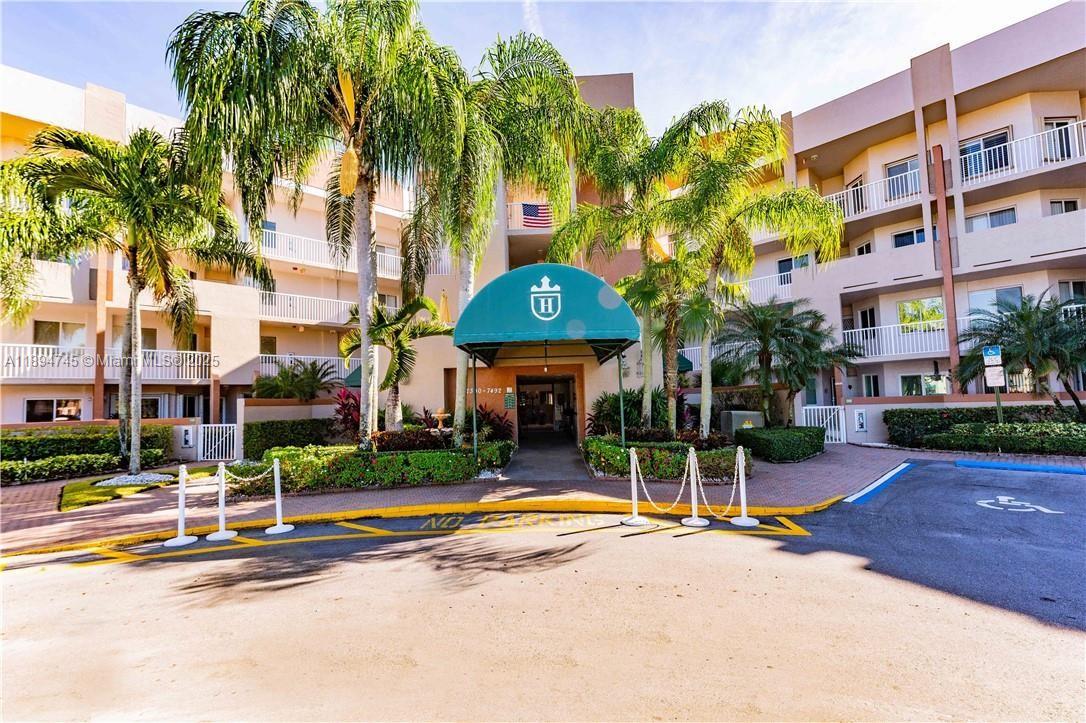 Beautifully upgraded 2/2 corner condo in Kings Point with over 2,000 SF and a wrap-around balcony showcasing serene lake views. Designer kitchen features top-of-the-line stainless steel appliances w/d, convection oven, double-drawer refrigerator, quartz counters, white cabinets imported from Spain, mosaic backsplash, cove lighting, touchless faucet, and a large pantry with built-ins. Custom fitted closets throughout. Baths boast stone accent walls, frameless glass and specialty shower heads. Elegant porcelain tile throughout, New flooring in bedrooms. All fixtures, fans & faucets are specially ordered. Newer water heater. New hurricane impact windows; terrace enclosed with glass doors for year-round use. Several amenities within desirable Kings Point. This unit is a must see!