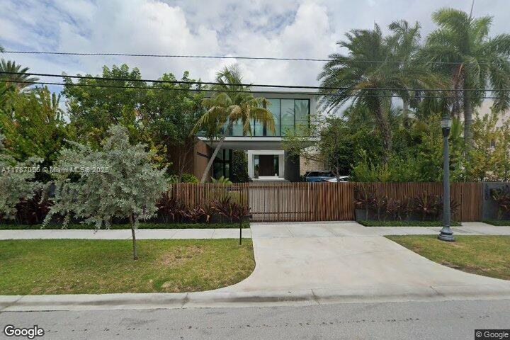 A modern, two-story waterfront estate masterfully designed by renowned architect Ralph Choeff, showcasing sweeping open bay views and striking downtown vistas, situated on the prestigious and highly coveted North Bay Road.