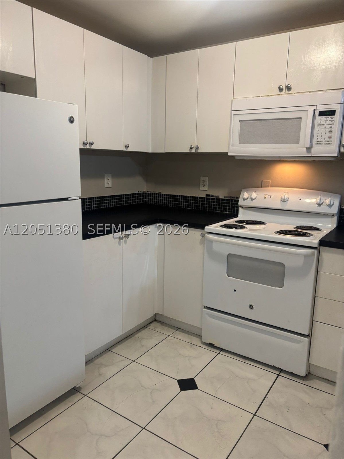 Excellent location with easy access to I-95 and the Florida Turnpike, just minutes from the beach. This charming first-floor unit features a private patio, perfect for relaxing or enjoying the outdoors. It offers an in-unit washer, along with a well-maintained kitchen and bathrooms, making it truly move-in ready. Fast association approval! A great opportunity for those seeking comfort, convenience, and a quick approval process.