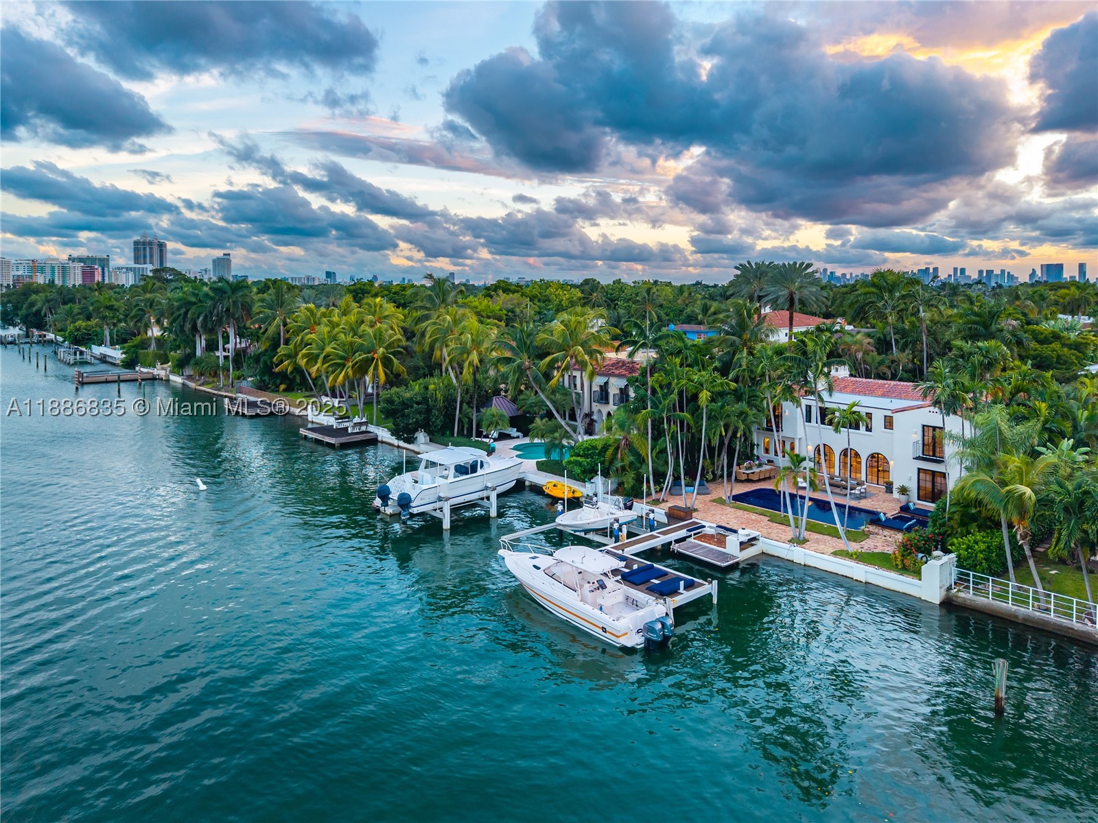 This stunning recently remodeled waterfront estate offers a perfect blend of timeless elegance & modern luxury. Set on a 10,214 Sq. Ft. lot, with 75' waterfrontage, this home features 4,697 Sq.Ft. of meticulously designed living space. With 5 Beds/4.5 Baths, the residence includes an impressive grand entrance, a gourmet kitchen & a custom wine cellar. The expansive outdoor oasis boasts a pool, lush gardens, & boat dock w/ a motorized +/-20,000Lb lift providing direct Intracoastal access with room for 2 boats. The primary suite offers unparalleled luxury experience, w/ a spa-like en-suite bath. Located on prestigious Pine Tree Drive, this estate home is just minutes away from world-class dining, shopping, schools & within walking distance to the beach.
