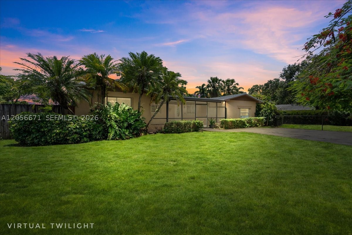Location, Location, Location! Fantastic opportunity in the desirable South Dade area! Tucked away at the end of a quiet cul-de-sac, this 3-bedroom, 2-bath home with an additional converted garage, offers flexibility for guests, a home office, or extra living space. Situated on an oversized 15,681 SF lot, there's plenty of room to expand, entertain, or store your toys. Inside, you'll find tile flooring throughout the main living areas, laminate flooring in the bedrooms, an updated kitchen and screened patios in both the front and back for year-round enjoyment. A newer roof (2025) adds peace of mind. Enjoy privacy, space, and an unbeatable location close to schools, shopping, dining, and major roadways.  Easy to Show & Ready to Go!