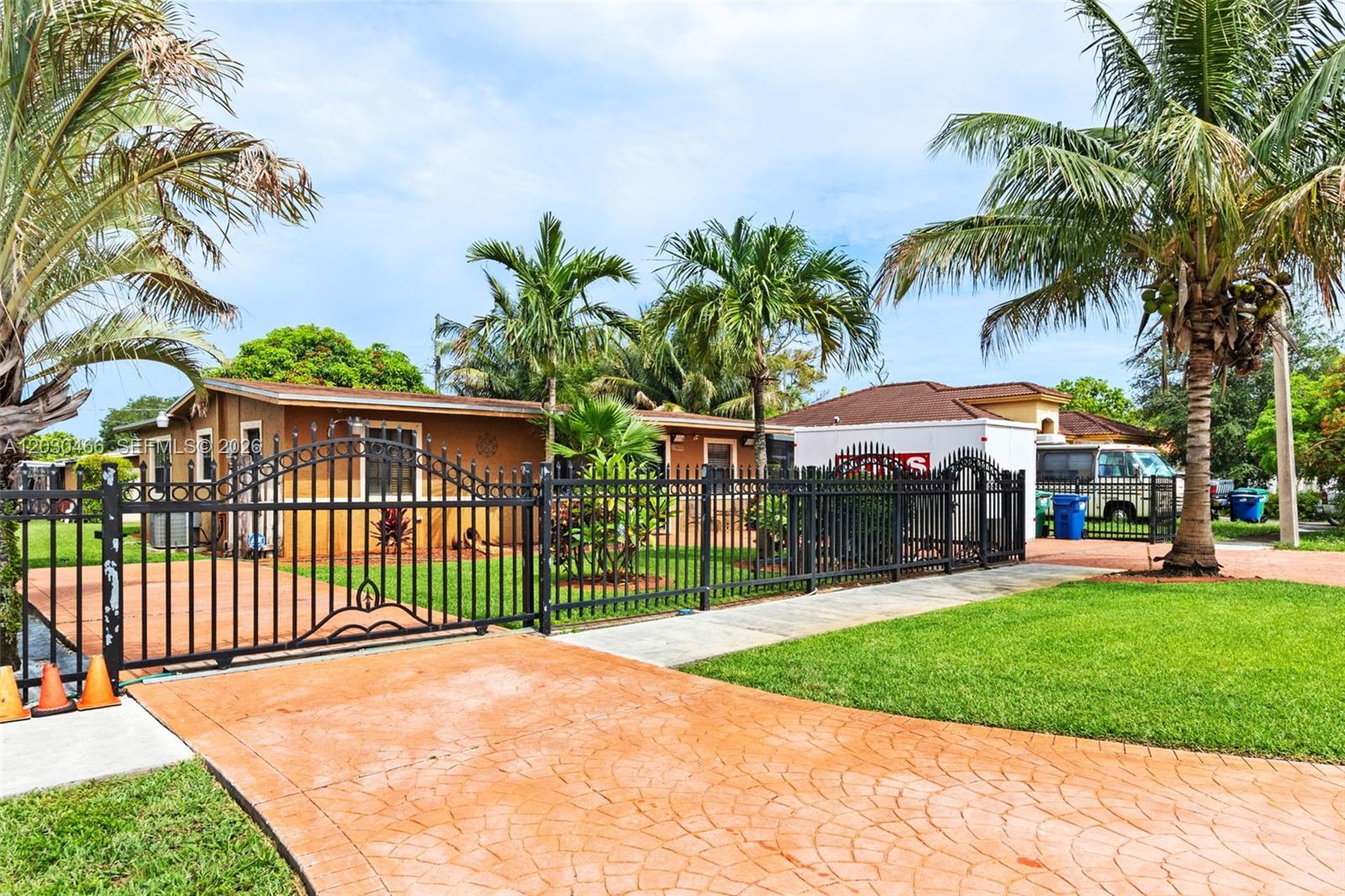 Discover this well-maintained 4-bedroom, 3-bath single-family home in Opa-locka, offering 1,765 sq. ft. of living area and 1,915 sq. ft. total. This property features numerous upgrades, including a newer roof, water heater, air-conditioning system, updated electrical panels, storm shields, and window blinds. The home is generator-ready and equipped with hard-wired security cameras that will convey with the sale.

The exterior is fully enclosed with wrought-iron and electric fencing and showcases a large mango tree and blueberry tree, creating a private and inviting outdoor space. Utilities include city water, a septic system professionally serviced monthly, and a separate well for irrigation.

An income-producing unit, providing excellent supplemental income potential of $1,300 per month. The unit includes a full kitchen, bathroom and bathroom.

Exclusions: Washer and dryer, generator, and refrigerator located in the rear unit do not convey with the sale.

Don't miss this exceptional opportunity to own a thoughtfully updated property with income-producing potential and valuable improvements already in place.