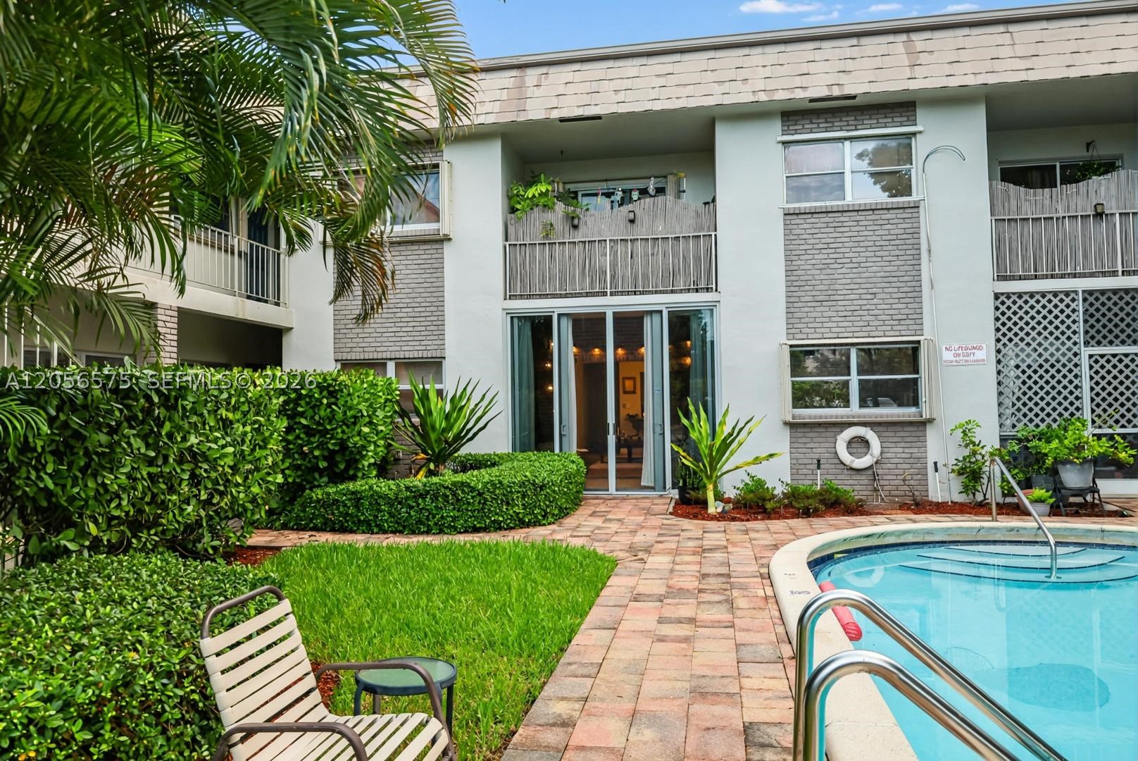Beachside living made easy! Ground-floor 2BR/1BA condo near the beach—perfect for first-time buyers and downsizers. Freshly updated with brand-new A/C, fully remodeled bathroom. Expanded enclosed patio opens to lush garden and pool. Single-level convenience, no stairs, parking at your door, low utilities. New roof 2026, assessments paid. Move-in ready and priced to sell. Won't last!