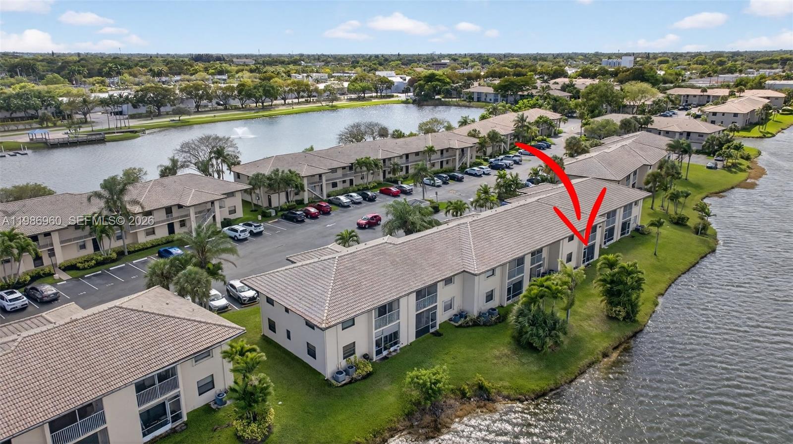 PRICED TO SELL FAST! Experience serene waterfront living in this beautifully maintained and updated, ground-floor condo in a secluded Gated waterfront community in the heart of Margate. Where breathtaking lake views and modern comforts meet, this move-in-ready unit features a bright, open-concept layout with uniform tile flooring throughout, a modern kitchen equipped with stainless steel appliances, and a primary living area that flows seamlessly through sliding glass doors to a private, screened porch perfect for enjoying the tropical South Florida breeze. Enjoy the peace of mind of being storm-ready with impact windows and doors as well as a washer and dryer conveniently inside your unit. Tastefully updated bathrooms provide both a shower and tub in the property both with elegant glass door enclosures. This prime location offers the ultimate convenience of ground-floor access and dedicated parking right outside your door. Nestled in a lushly landscaped secluded and gated Margate community, this lakeside gem provides a peaceful retreat just minutes from local dining, shopping, and major highways Do not miss this opportunity! No Leasing Permitted.
