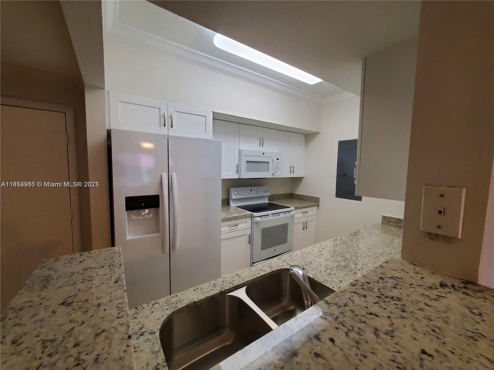 GREAT UNIT AT MARQUESA, SPLIT FLOOR PLAN, 3 BEDROOMS, 2 FULL BATHROOMS, ONE CAR GARAGE + ASSIGNED PARKING. UPDATED AND UPGRADED, SHAKER STYLE KITCHEN CABINETS, GRANITE COUNTER TOP. NEWER VANITIES IN BOTH BATHROOMS WITH GRANITE COUNTER TOPS, FRESHLY PAINTED. TILE AND LAMINATE WOOD FLOOR, BLINDS. FULL SIZE WASHER & DRYER, READY TO MOVE IN. RESORT STYLE COMPLEX, WITH LOTS OF AMMENITIES, GYM, BBQ AREA, CHILDREN'S PLAYGROUND, POOL, RACQUET BALL COURT. WALKING DISTANCE TO SHOPS, RESTAURANTS AND MORE.