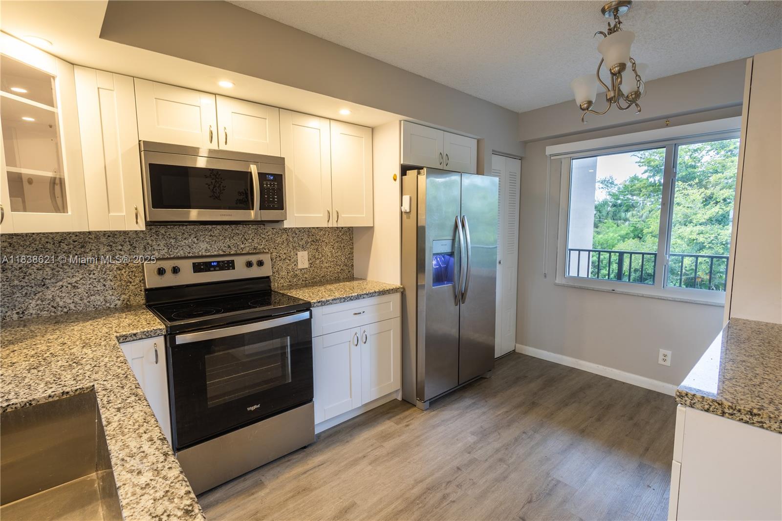 Spacious 2 bedroom 2 bath with large ENCLOSED BALCONY , storage room and Washer/Dryer IN UNIT! Walk in Closets, oversized kitchen for breakfast table, split layout and huge living/dining area. Condo fee includes cable, water and the amazing RESORT style community for age 55+ --Free Shuttles, Swimming, Tennis Courts, Pickle Ball, Golf Course, Sailboat & Paddle boats, Health club, Fitness Center, State-of-the-art Theater, Party Room, Billiards, Ping Pong, Library, computer rooms, 24/7 Security, landscaping, & much more. Close to Pembroke Pines Mall, Pembroke Gardens, and all major highways. SOLD AS IS, and very easy to see!