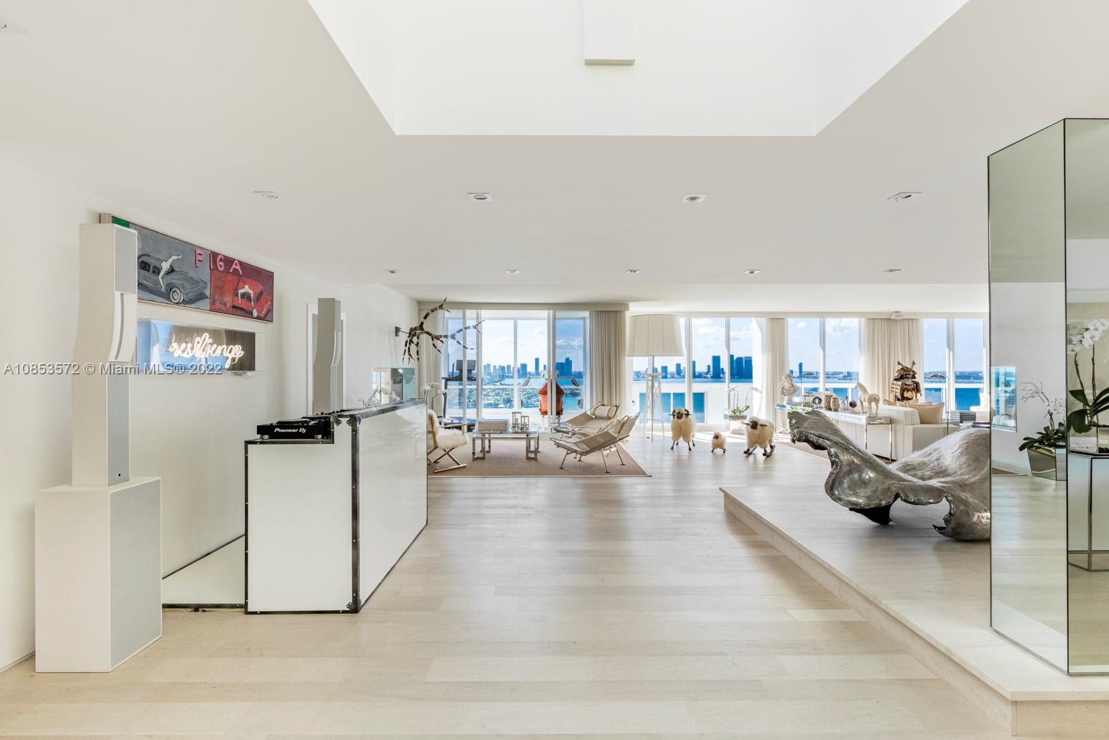 Step Inside With Me! Sunrise to Sunset Tower Suite- a celebrity penthouse in Sunset Harbour, SoBe. By the Numbers: Towering at 26 stories, interiors over 7,000SF, 4 bedrooms + staff, 3 parking, 2 views, & 111 linear feet on Biscayne Bay. Completely reconstructed & renovated in minimalist, modern aesthetic with a 2500 SF living salon, a dramatic master suite facing the ocean, a private chef’s kitchen, an open concept media room, & endless natural light from dual East/West exposures. Plus, a spectacular VIP suite with fireplace & an office floating over the bay. The fiercest views of the Downtown skyline from a private 1600sq.ft rooftop can be yours. Experience the global lifestyle in the most prized boutique community of Miami Beach with shops, fitness studios, spas, cafes & top restaurants